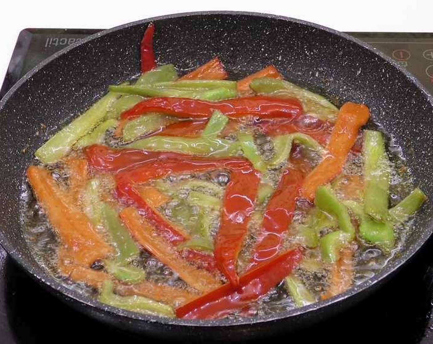 step 9 Fry the peppers in enough oil that they are covered. We do not have to cook them completely as they will finish cooking in the oven.