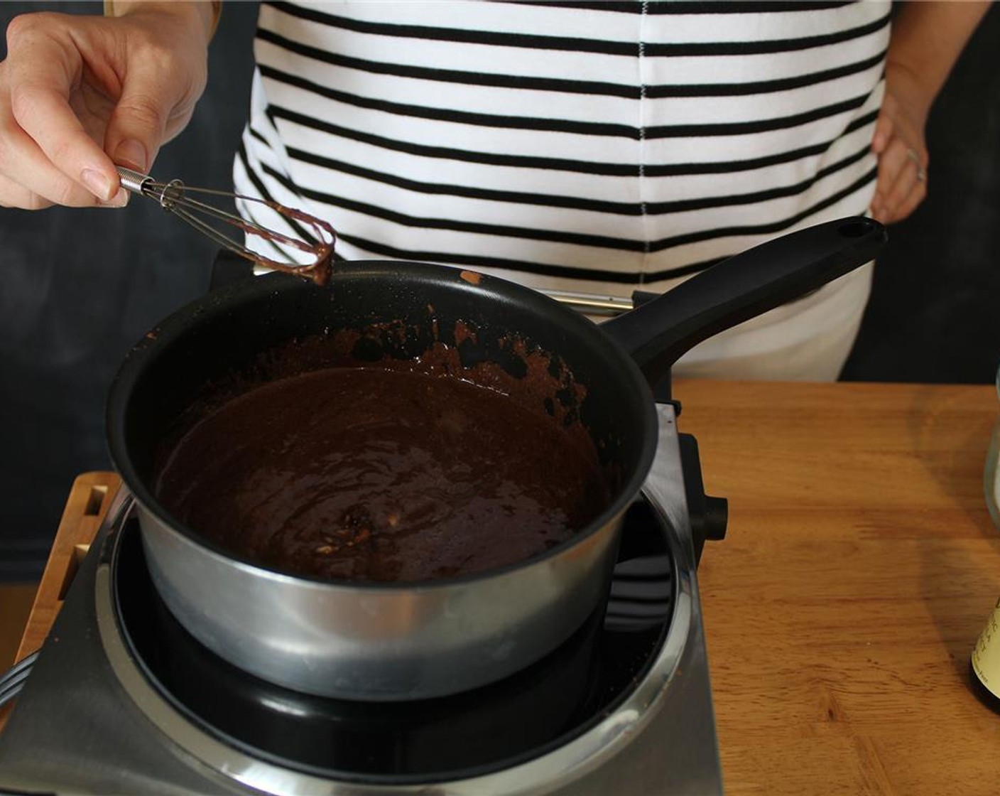 step 8 To make the frosting, heat a small saucepan over medium heat and whisk together the Buttermilk (3 Tbsp), Unsalted Butter (1/4 cup), and Unsweetened Cocoa Powder (1/4 cup).