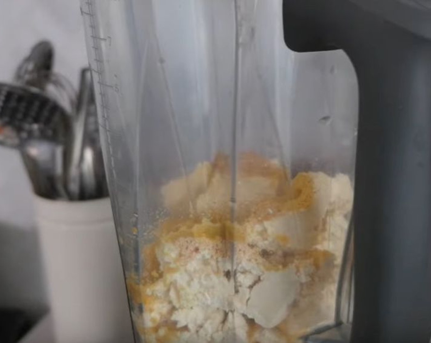 step 1 To start, place Firm Tofu (1 block), Nutritional Yeast (1 Tbsp), White Miso Paste (1 Tbsp), Refined Coconut Oil (5 fl oz), the juice from Lemon (1), Apple Cider Vinegar (1 Tbsp), Salt (1 tsp), and Simply Organic Onion Powder (1 tsp) in a blender and puree until very smooth, scraping down the sides.