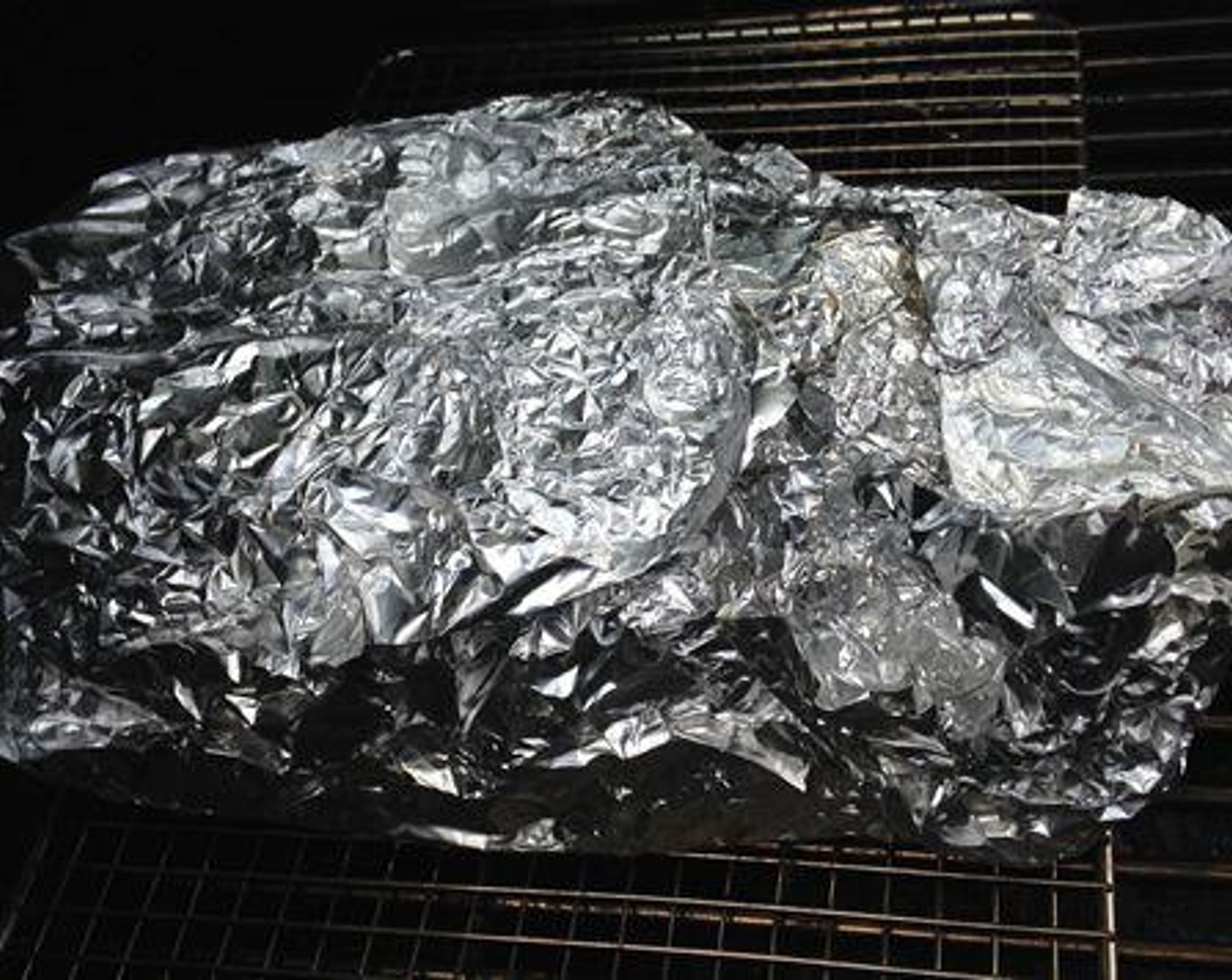 step 4 Once the pork butt hits 160 degrees F (71 degrees C) internal, usually around 5 - 6 hours of smoke, it's time to wrap. Place the aluminum ​foil on the work surface and sit​ the meat on it. Wrap the pork up tight in the aluminum ​foil and place it back on the smoker.