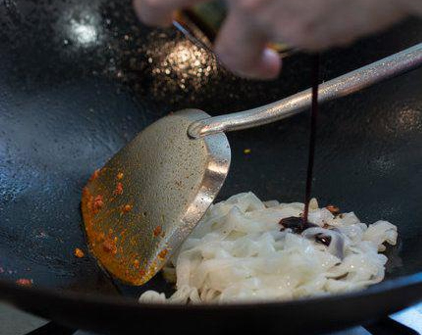 step 4 Add Rice Noodles (1 1/2 cups) into the wok. Drizzle the Light Soy Sauce (2 Tbsp), Dark Soy Sauce (1/2 tsp) and Oyster Sauce (1/2 tsp) over the noodles. Stir well. Make sure all of the noodles are covered in the sauce.