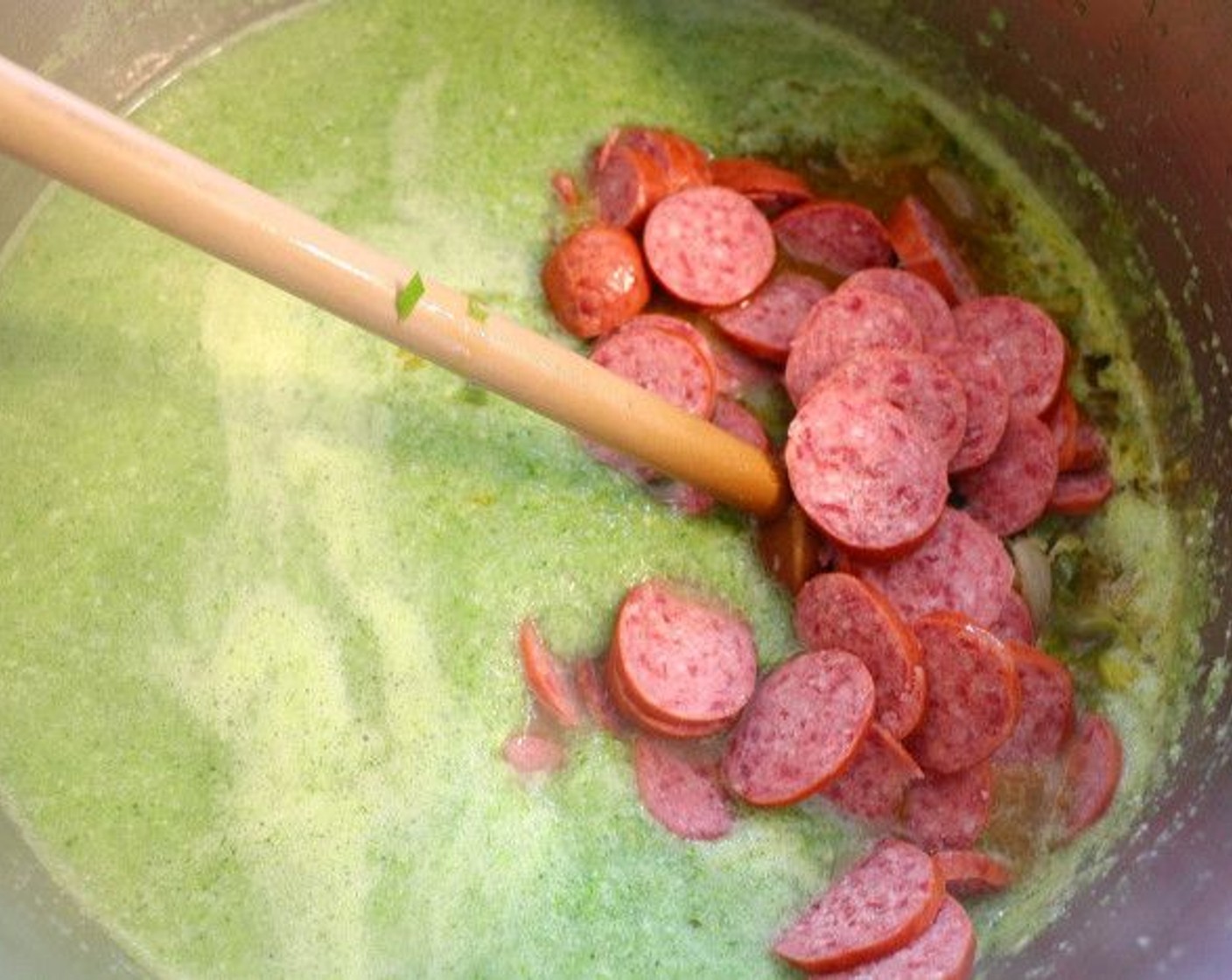 step 8 Add in Smoked Sausages (6 oz), simmer for 2 more minutes.