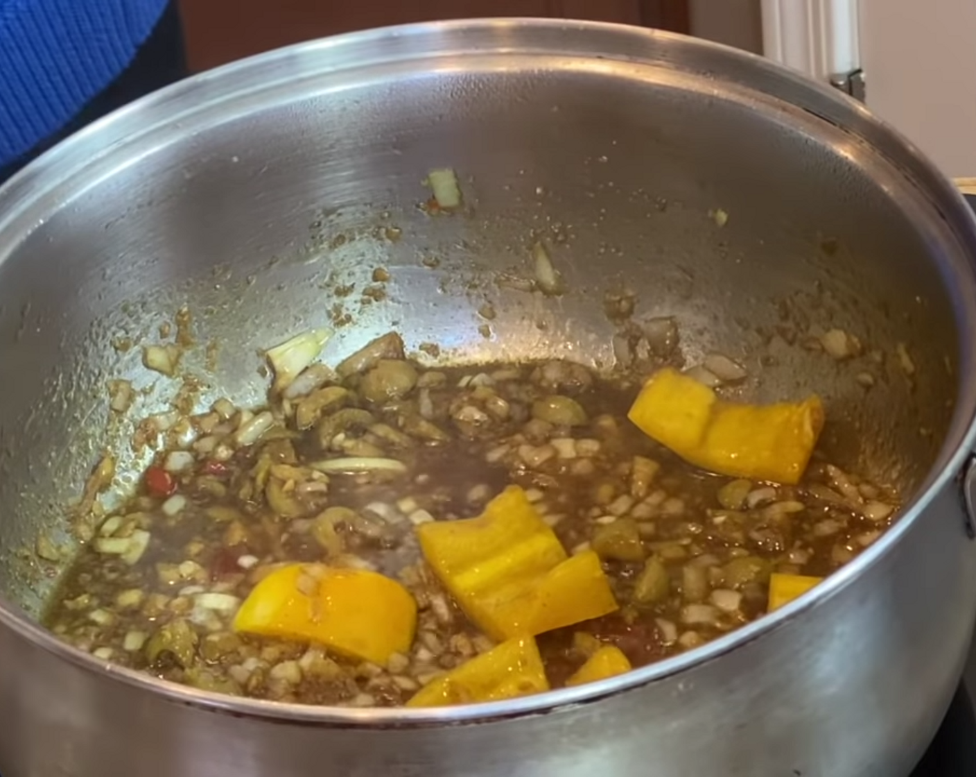 step 2 Add Yellow Onion (1/2), Yellow Bell Pepper (1/2), Pimento Stuffed Green Olives (2 Tbsp), and stir.