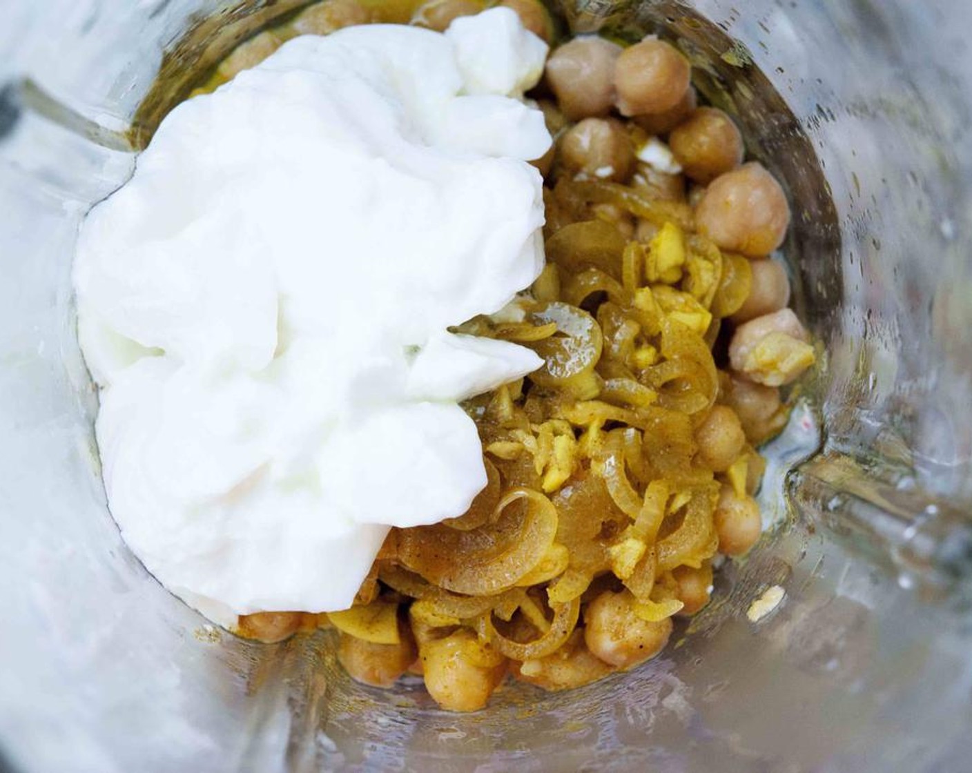step 3 In a blender or food processor combine Canned Chickpeas (1 1/2 cups), Greek Yogurt (1/2 cup), onion and garlic, Lime (1), Salt (to taste), and Ground Black Pepper (to taste).