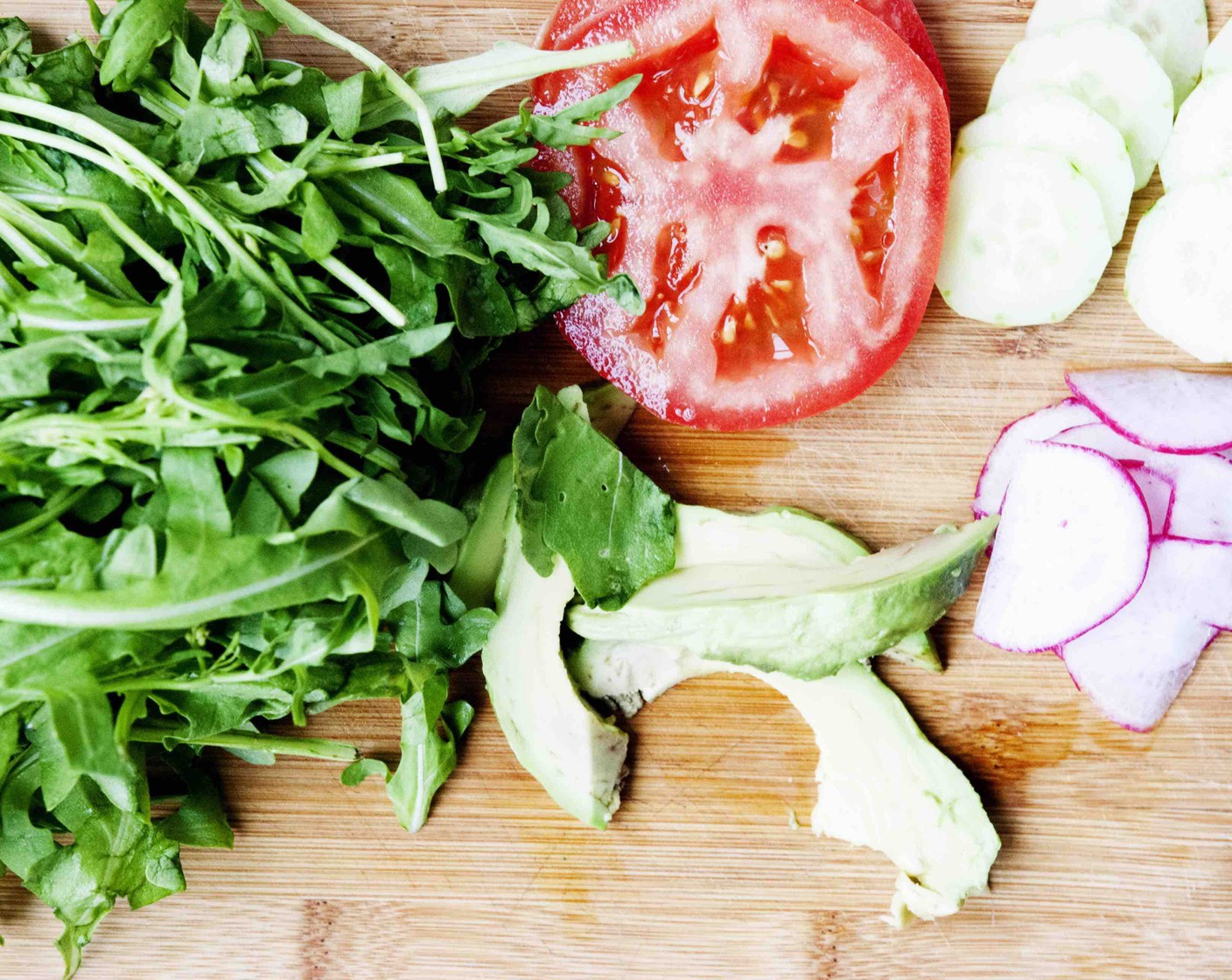 step 6 Gather the Tomatoes (2 slices), Radish (1 bunch), Cucumber (1/2), Arugula (to taste), and Avocado (1/4).