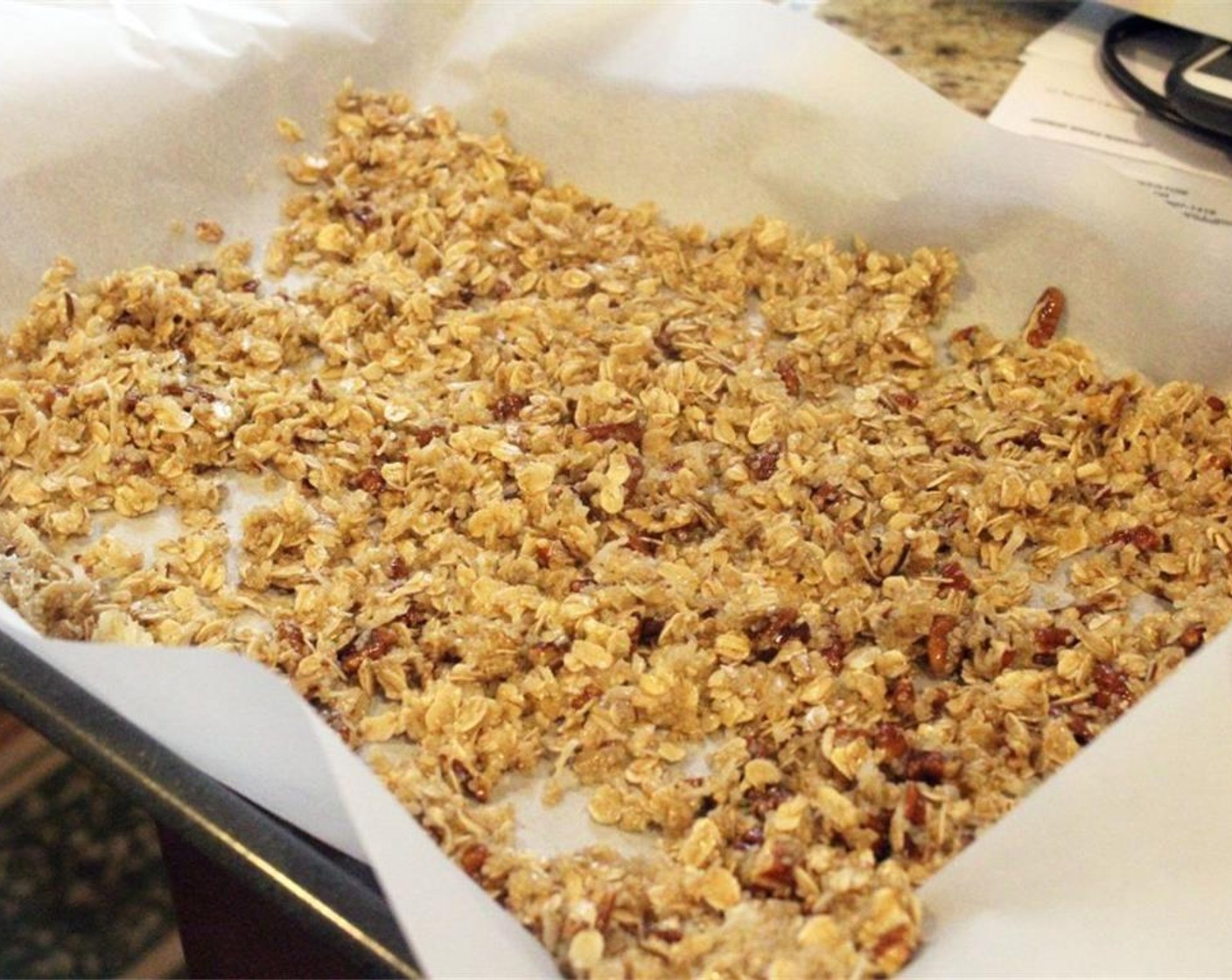 step 8 Spread granola mixture on the sheet pan in one even layer.