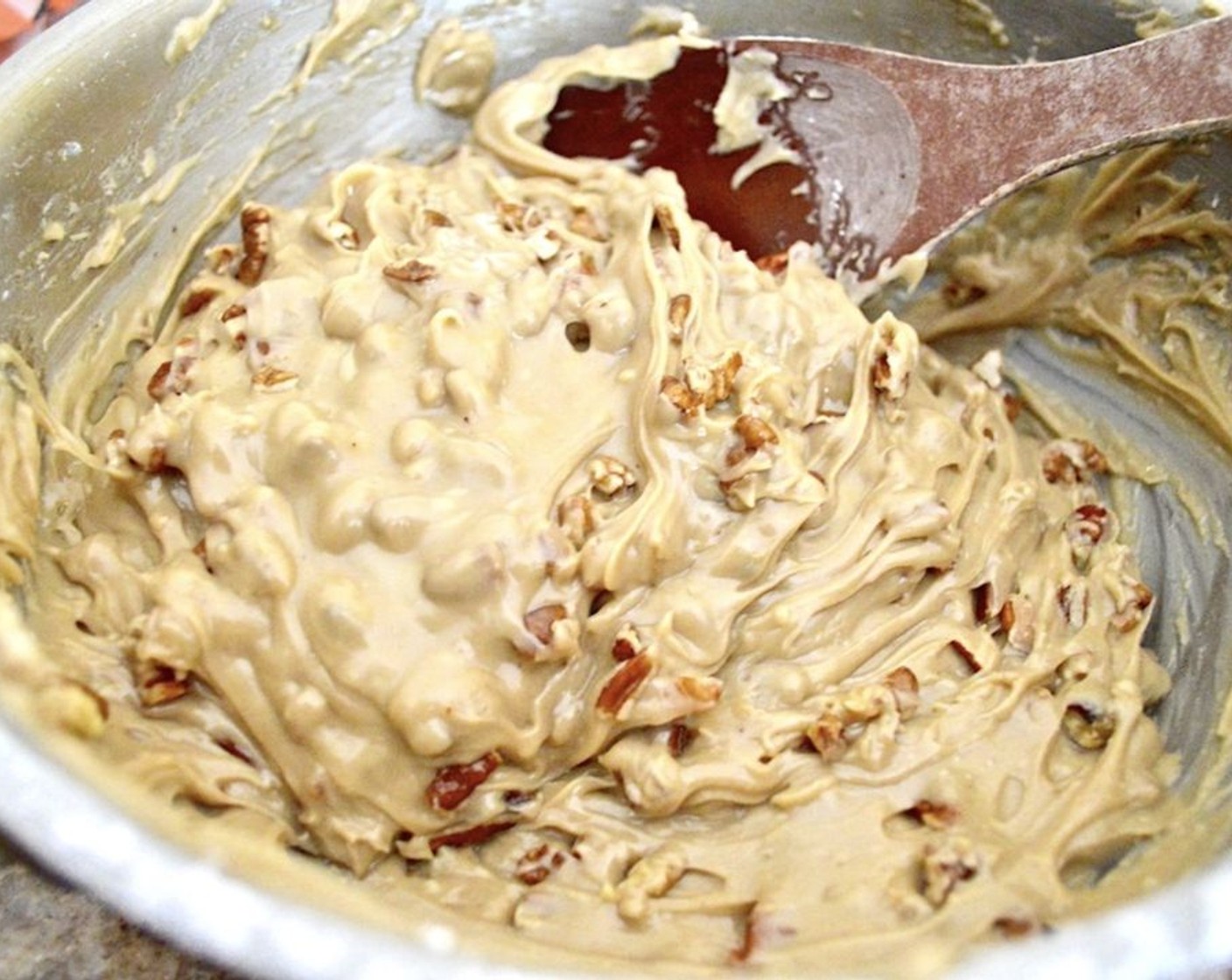 step 11 Stir in the Powdered Confectioners Sugar (2 cups) until you have a nice icing. Then stir in the Chopped Pecans (1 cup).