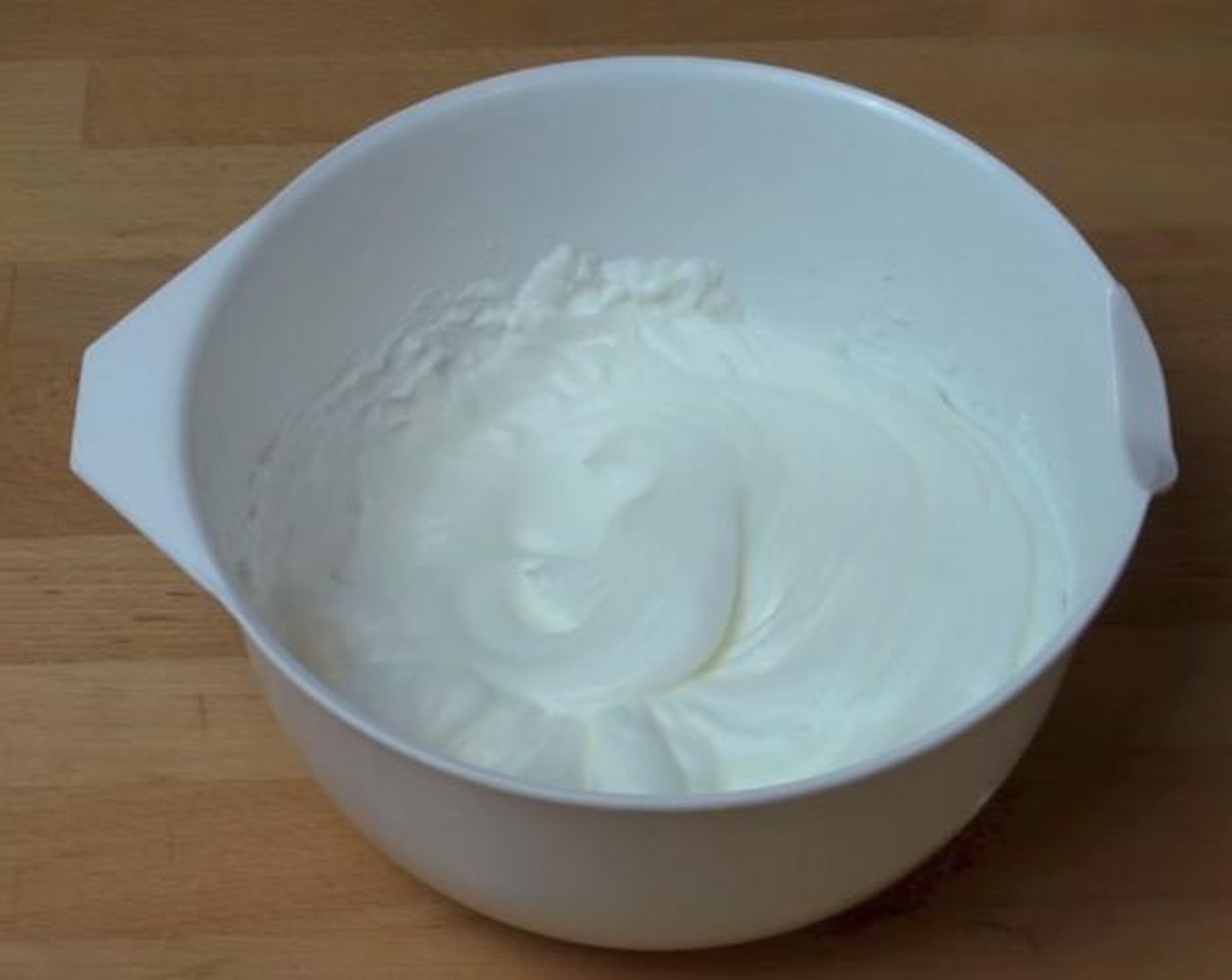 step 3 In a mixing bowl, beat the Egg Whites with an electric mixer until mixture forms stiff peaks.