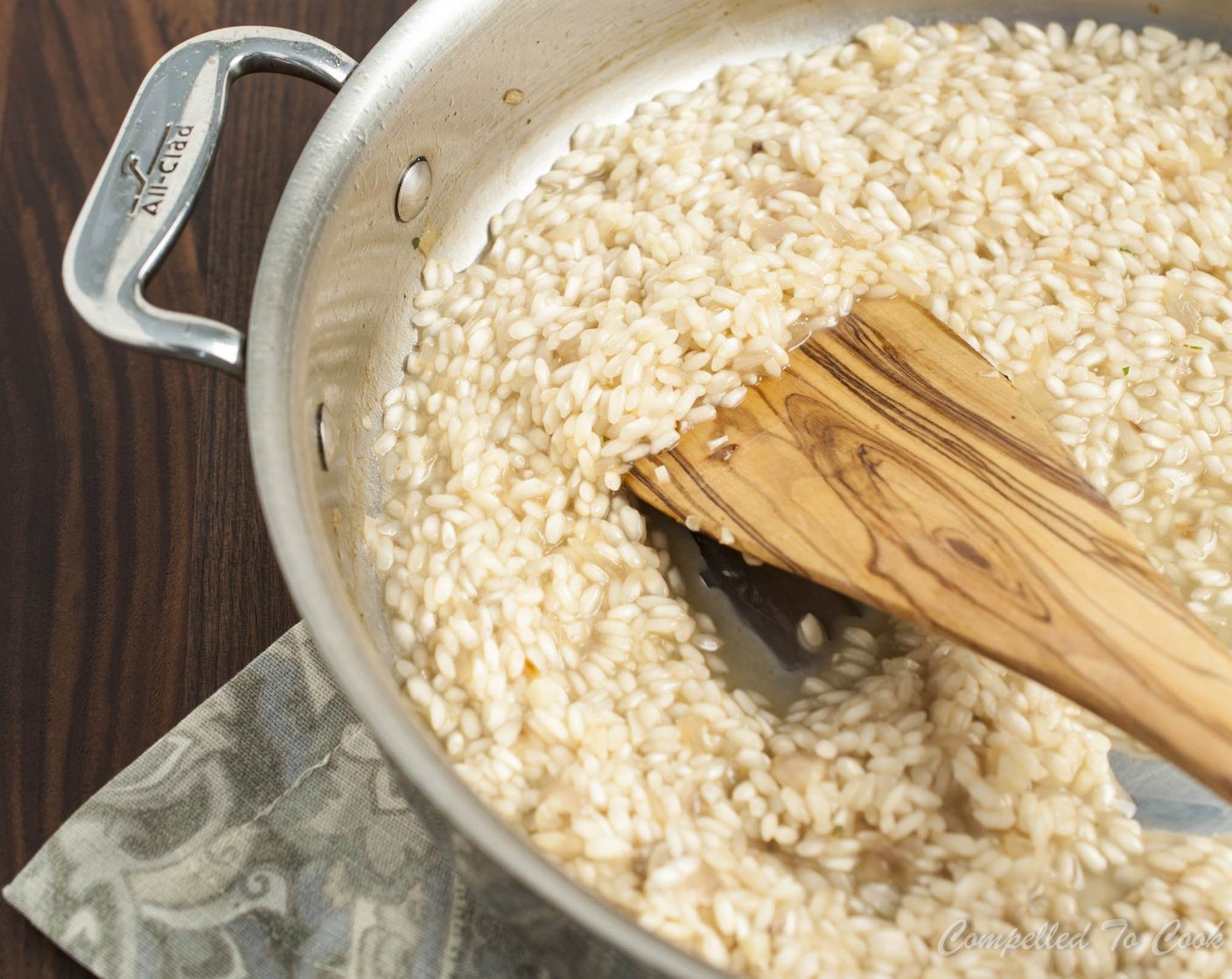step 4 Stir in Arborio Rice (1 cup) and continue to sauté and stir until rice is coated, about 1 minute. Add White Wine (1/4 cup), stirring to combine and scraping up any bits stuck to the pan. Allow wine to be mostly absorbed, about 1 minute.