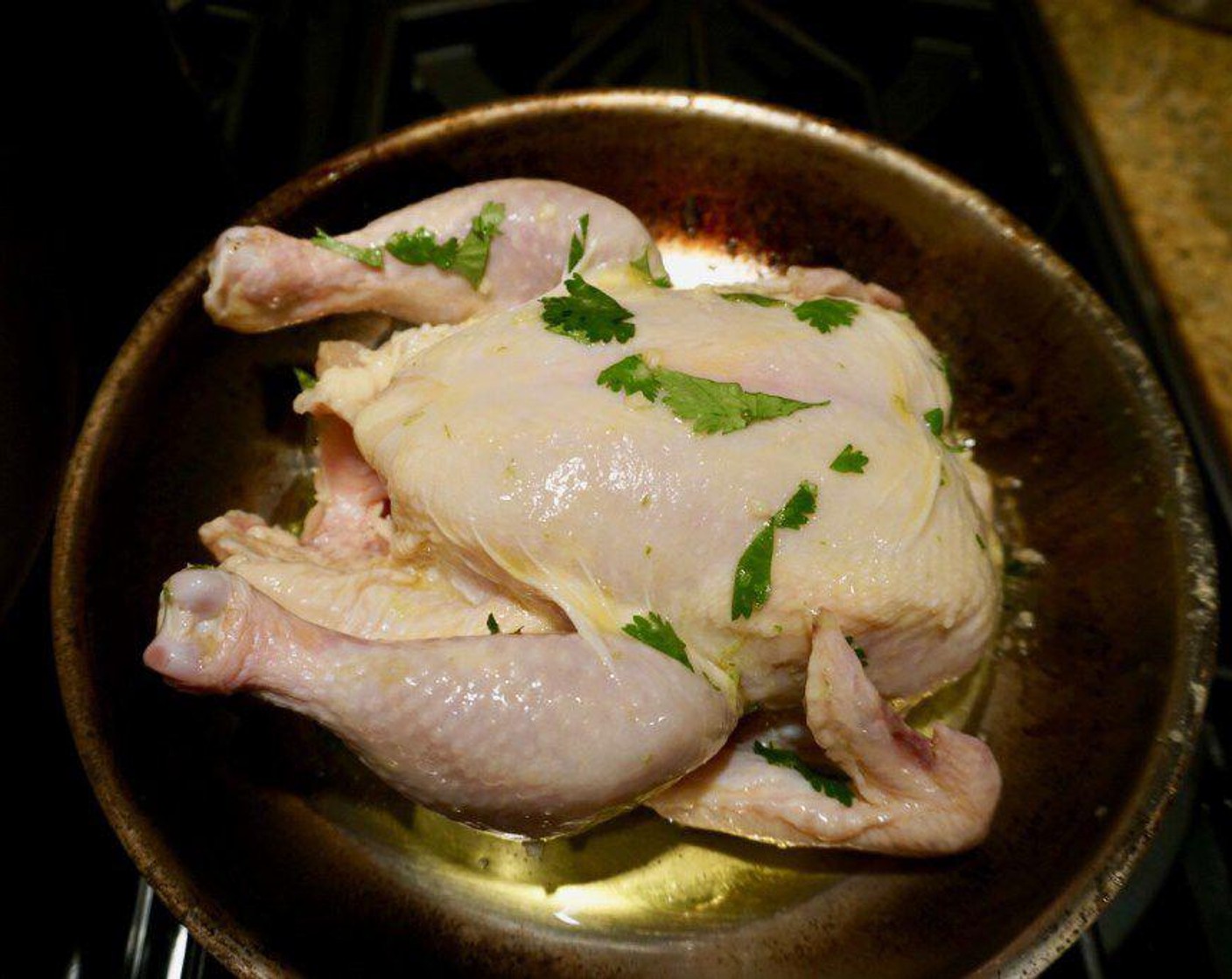 step 4 Loosen the skin from the breast and legs of the chicken and, using your clean hands, spread the mixture underneath. Rub the remaining mixture all over the outside of the chicken. Set aside for 20 minutes before roasting.