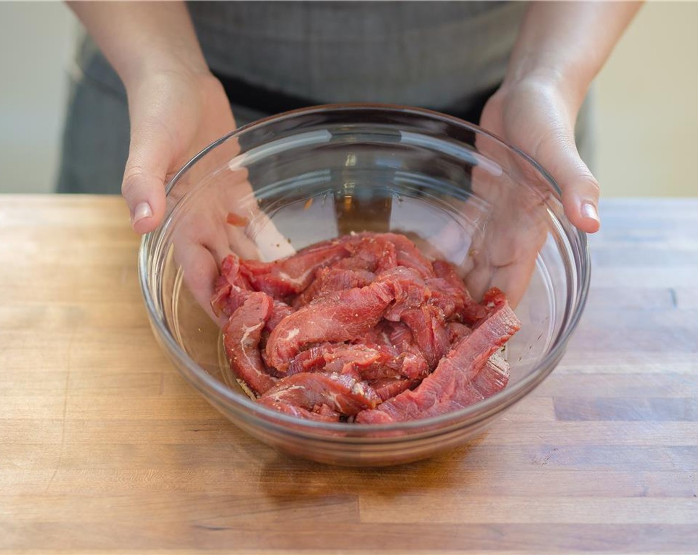 step 3 Pat dry Flank Steak (14 oz). Slice against the grain into 1/2 inch pieces. Place in a bowl and add Tamari Soy Sauce (2 Tbsp), Granulated Sugar (2 tsp), Sesame Oil (1 Tbsp), Hoisin Sauce (2 tsp), and Ground Black Pepper (1/4 tsp). Coat to combine.