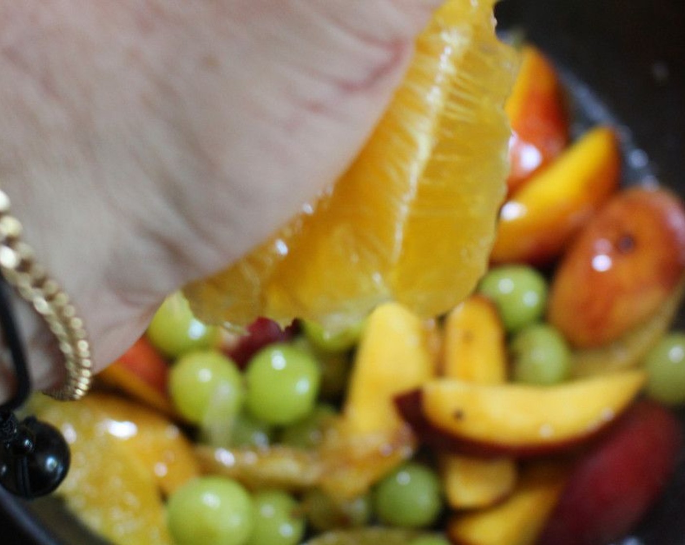 step 6 Add some juice from the leftover orange pieces, and cook until slightly thickened. Then remove from heat.