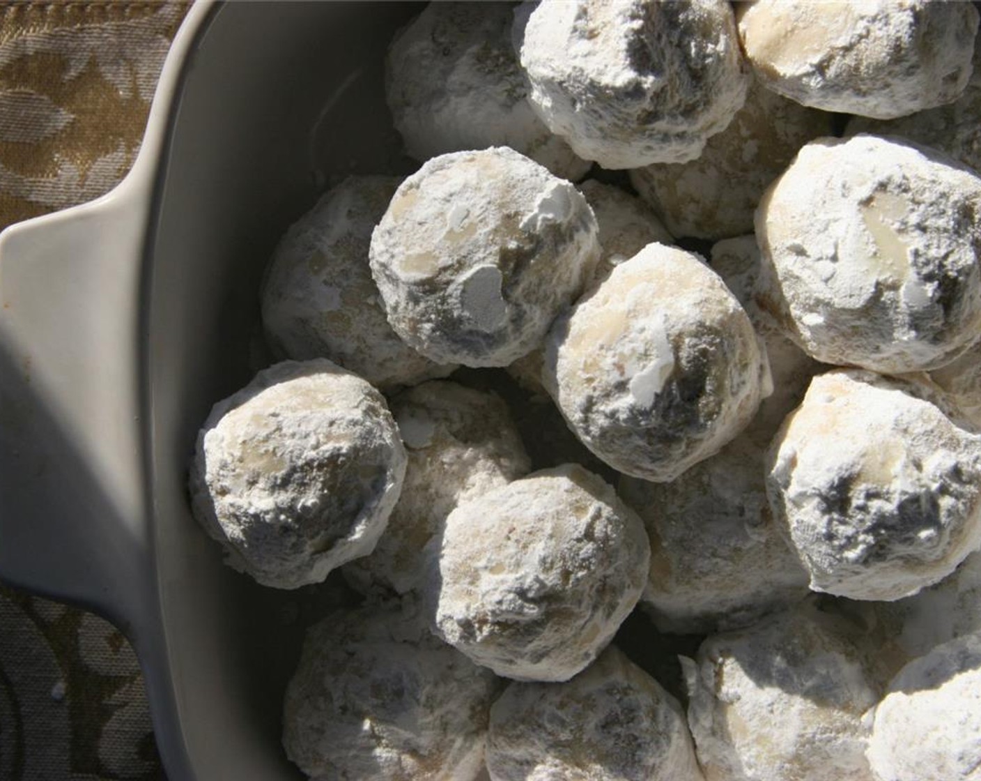 step 7 Set on wire rack to cool completely. Roll in powdered sugar again.