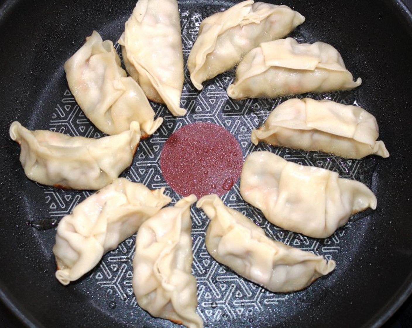 step 4 Sauté gyozas in Peanut Oil (1/2 Tbsp) until lightly browned.