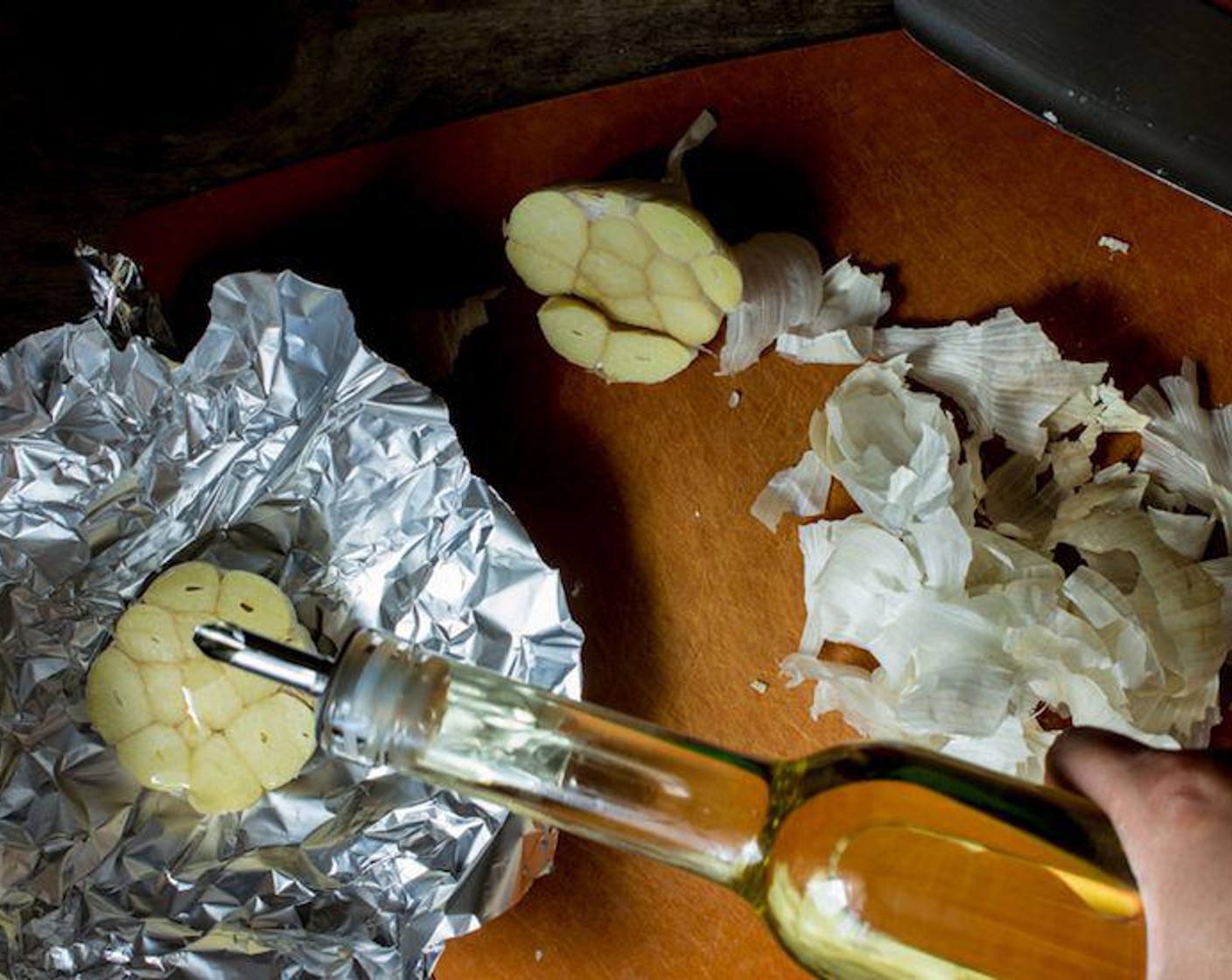 step 6 Place the bottom of the garlic in a large piece of foil and drizzle Oil (3 Tbsp) on it liberally.