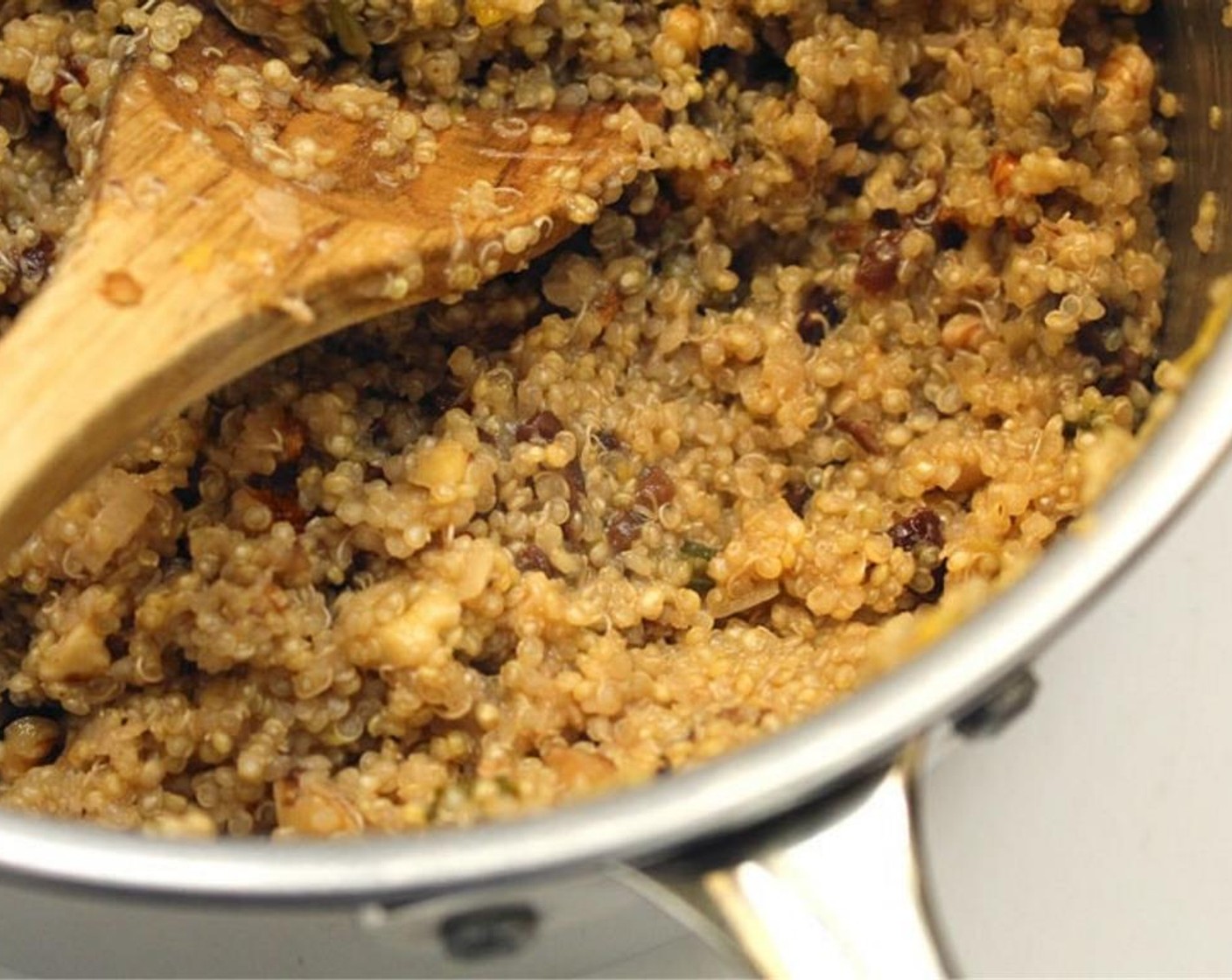 step 3 Add Quinoa (1 cup), Lemon (1), Sun-Maid Raisins (4 Tbsp), Cayenne Pepper (1 dash), Salt (to taste), and Ground Black Pepper (to taste). Cook for about 2 minutes.
