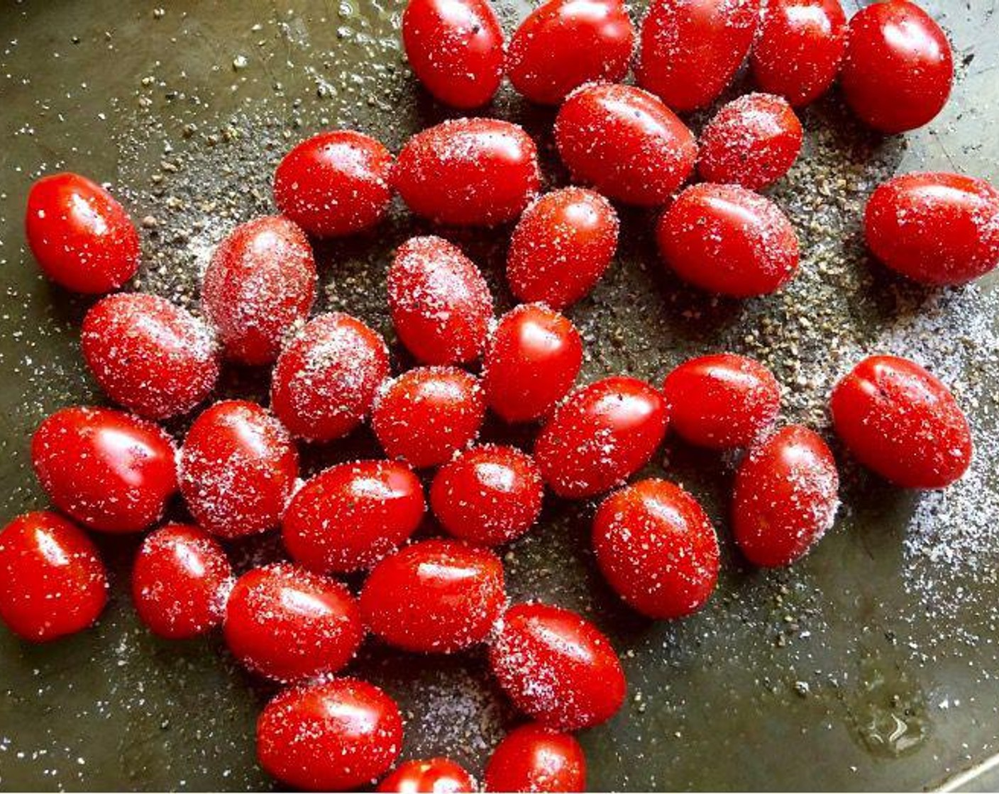 step 4 Toss together Cherry Tomatoes (2 cups), Kosher Salt (1 tsp), Freshly Ground Black Pepper (1 tsp), and Extra-Virgin Olive Oil (1 Tbsp) on a rimmed baking sheet.