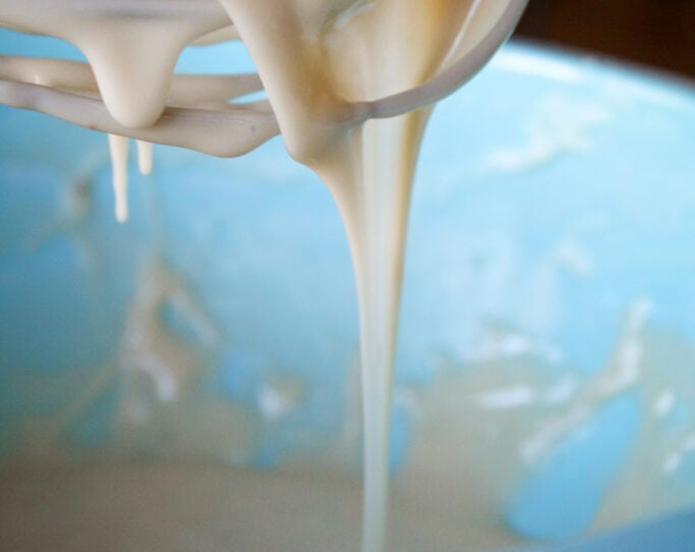 step 11 While rolls are rising for the second time, combine Powdered Confectioners Sugar (4 cups), Pure Maple Syrup (1/3 cup), Whole Milk (1/3 cup), and reserved bacon grease in a medium-sized bowl. Using a whisk, mix ingredients until thoroughly combined. Set aside.