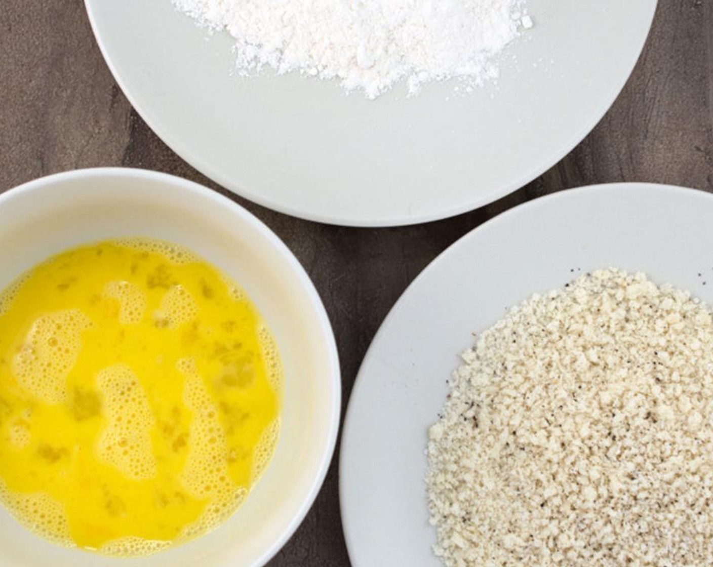 step 2 Begin by lining up a plate with All-Purpose Flour (1/4 cup), a bowl with the beaten Egg (1), and a plate with the Panko Breadcrumbs (3/4 cup).