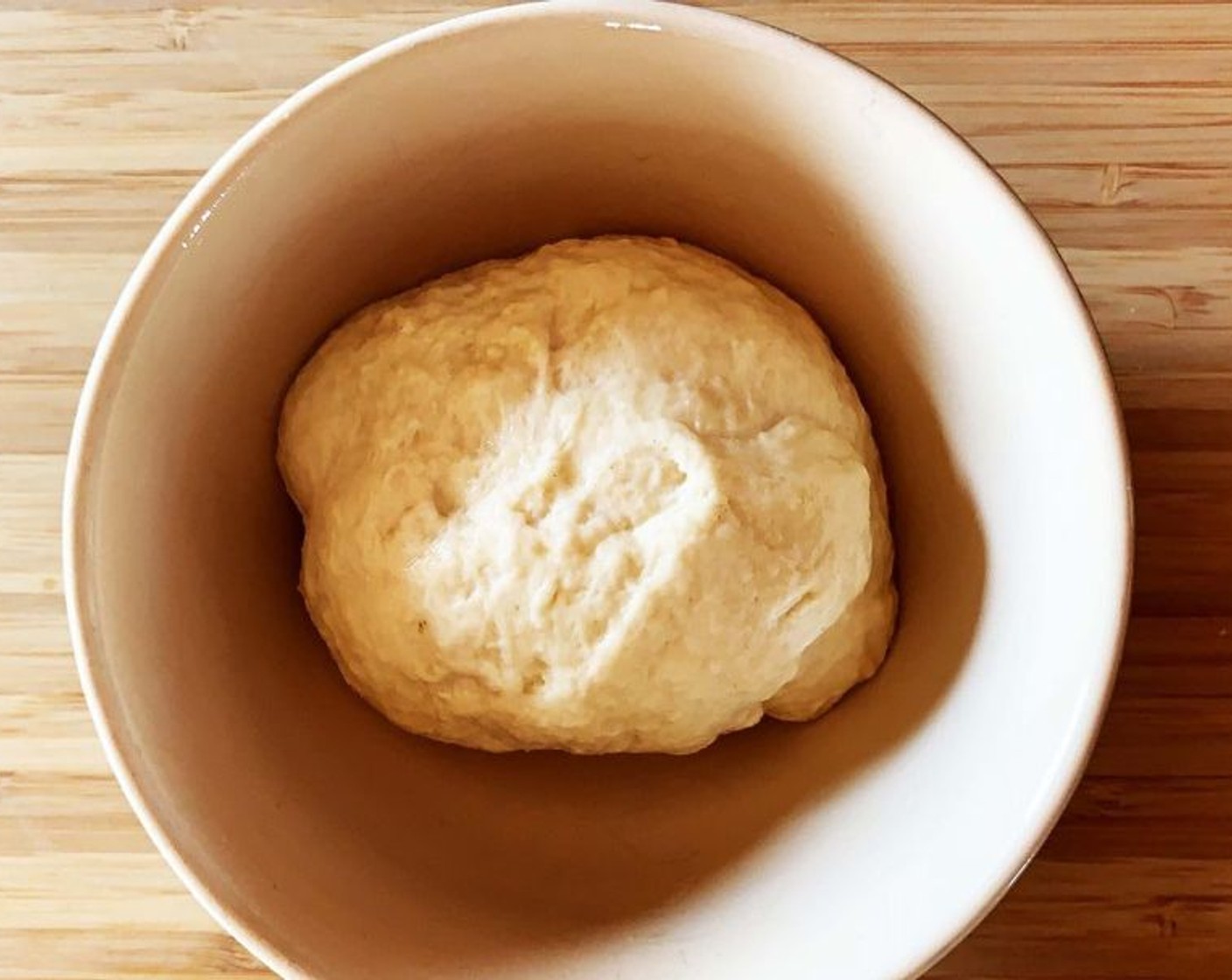 step 3 Add Extra-Virgin Olive Oil (1 tsp) and whey mix to the flour in a large bowl, then knead the mixture until you get a smooth and elastic dough.