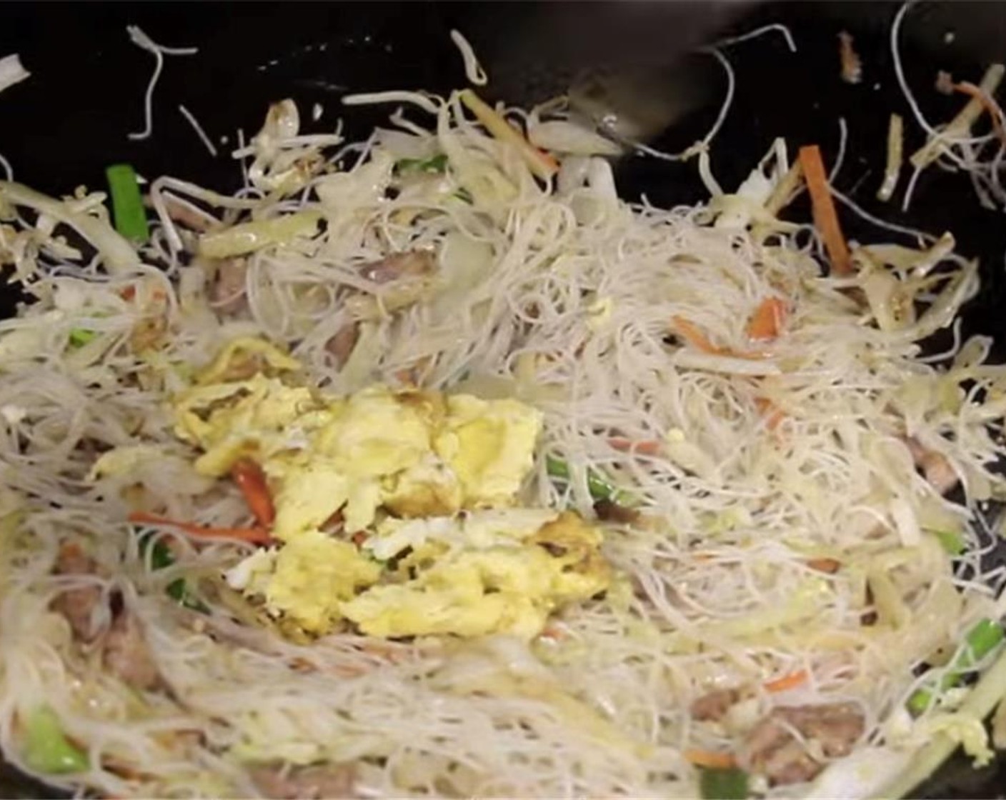 step 20 Break the cooked egg apart then add it back into the wok. Toss for another 30 seconds. Add Oyster Sauce (1/2 tsp), Sriracha (to taste), and Sesame Oil (1/2 Tbsp) then toss for another 45 seconds to a minute.