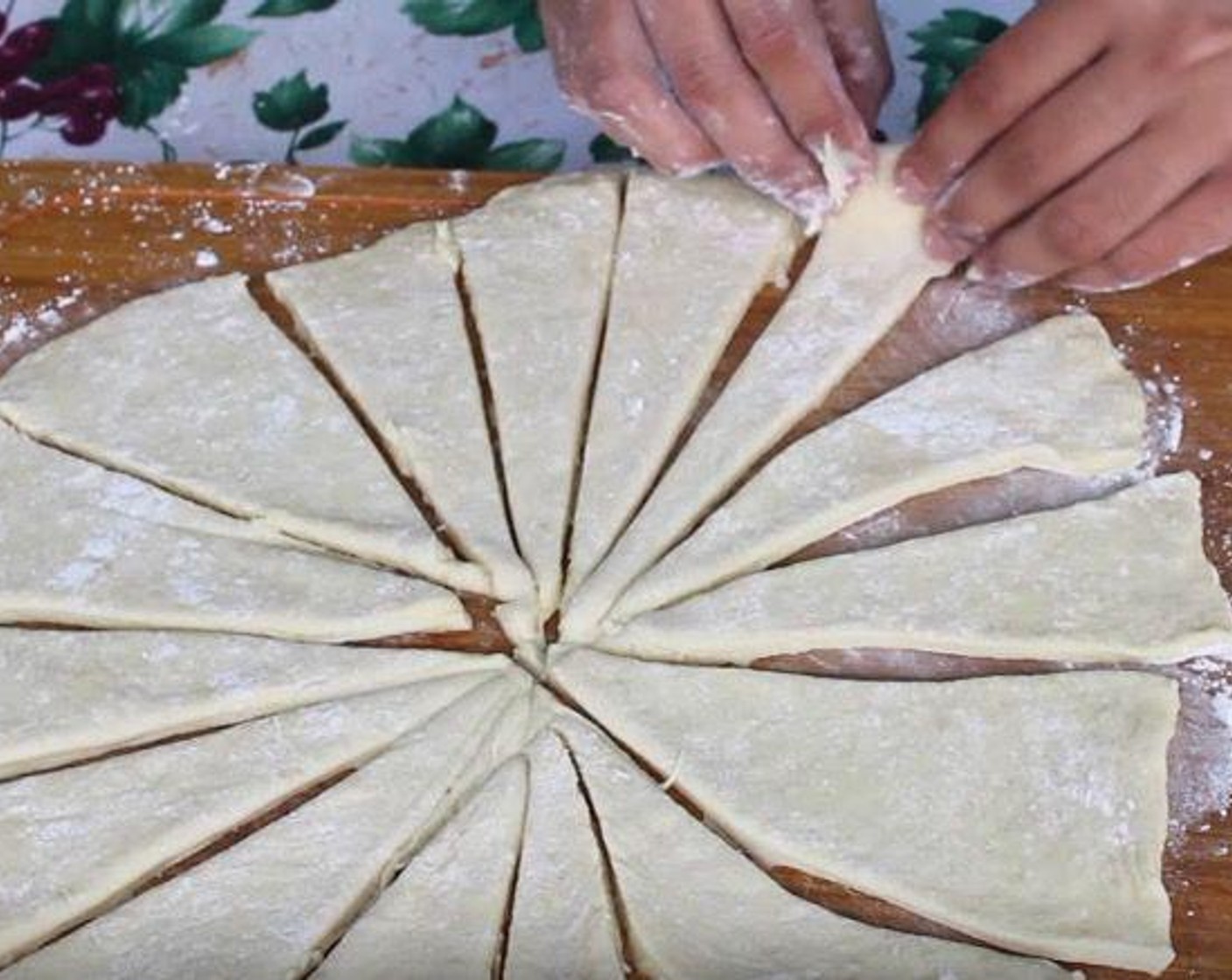 step 4 Split the dough into two equal portions. Roll them out on a lightly floured surface into 12 to 15-inch circles. Cut each circle into 16 slices.