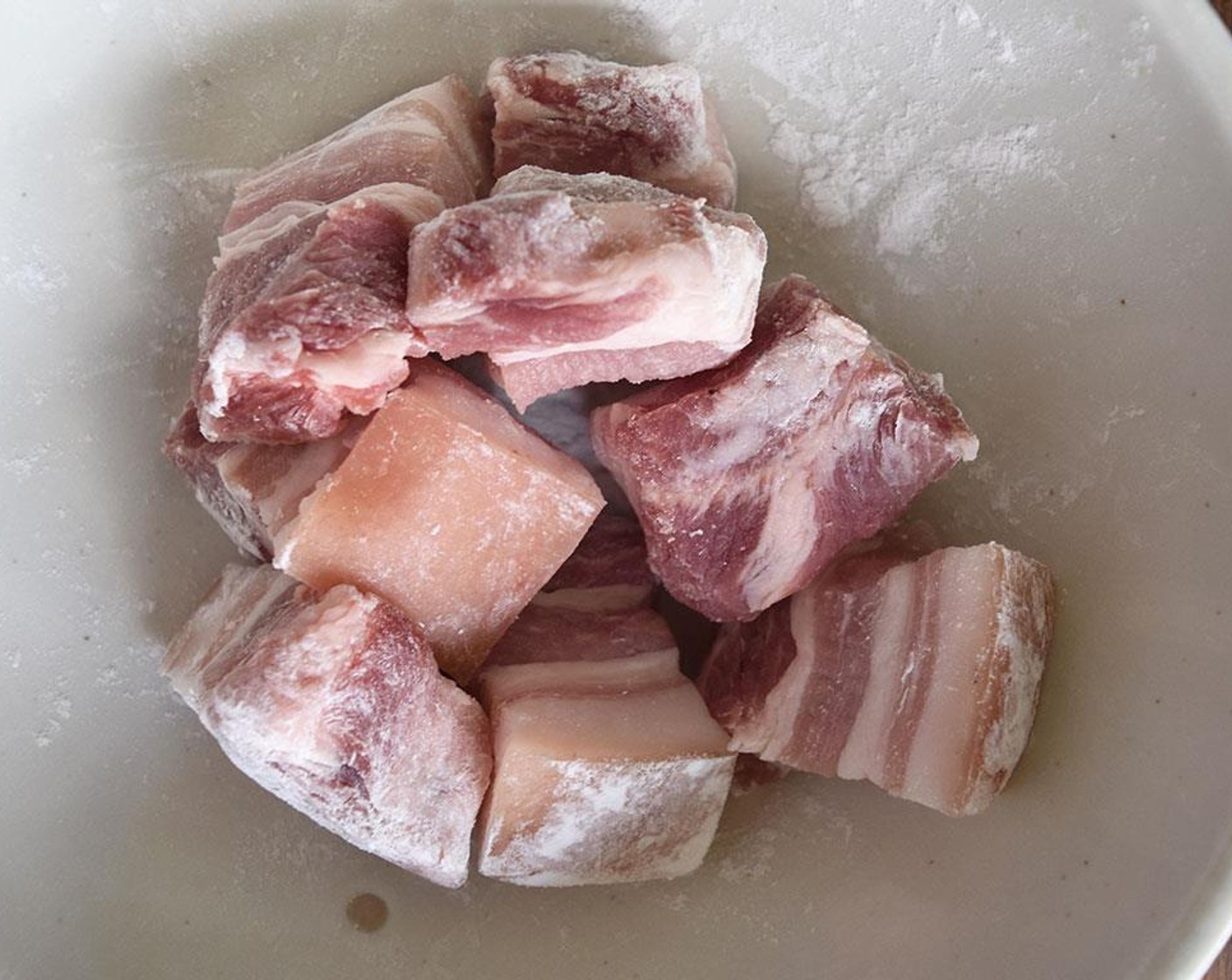 step 11 Slice Skin-On Pork Belly (2 lb) as seen in the picture. Toss with Baking Soda (1/2 Tbsp) in a small bowl.