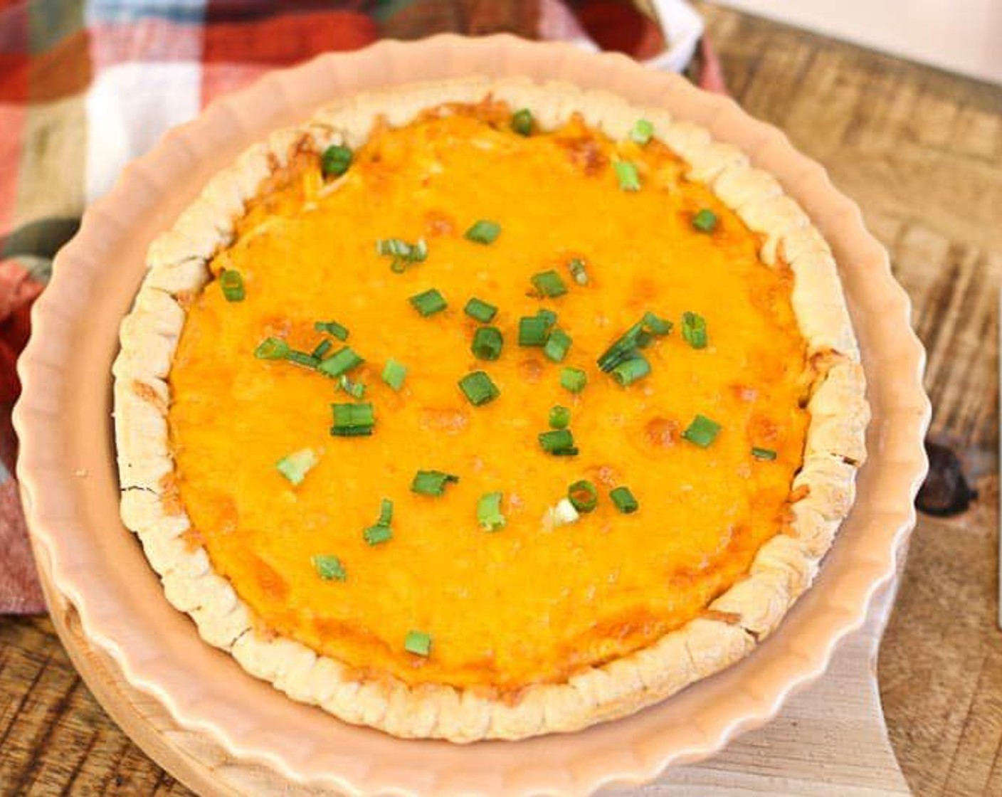 step 7 Let the pie rest 5 minutes, then slice and serve. Top with Scallions (to taste) if desired.