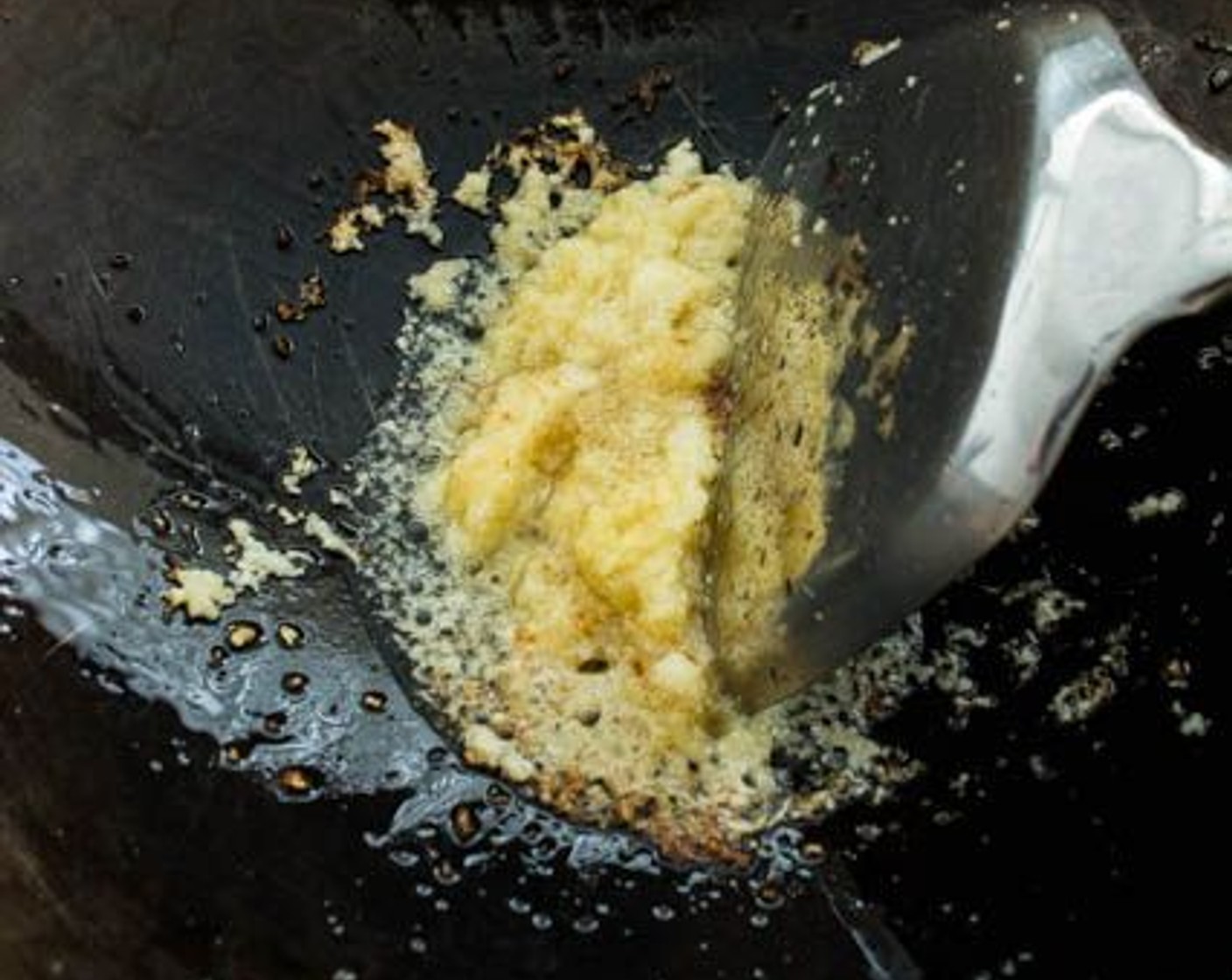 step 2 Add Fresh Ginger (1 Tbsp) and Garlic (4 cloves) to the oil. Sauté until aromatic, approximately 30 seconds to 1 minute.