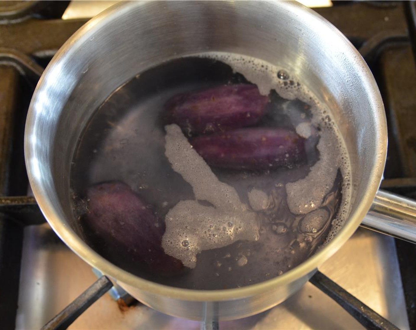 step 10 Wash and peel the Purple Potatoes (1 1/3 cups) then place in a small pot. Cover with water and bring to a boil. Reduce to a simmer until the potatoes are fully cooked about 15 to 20 minutes.