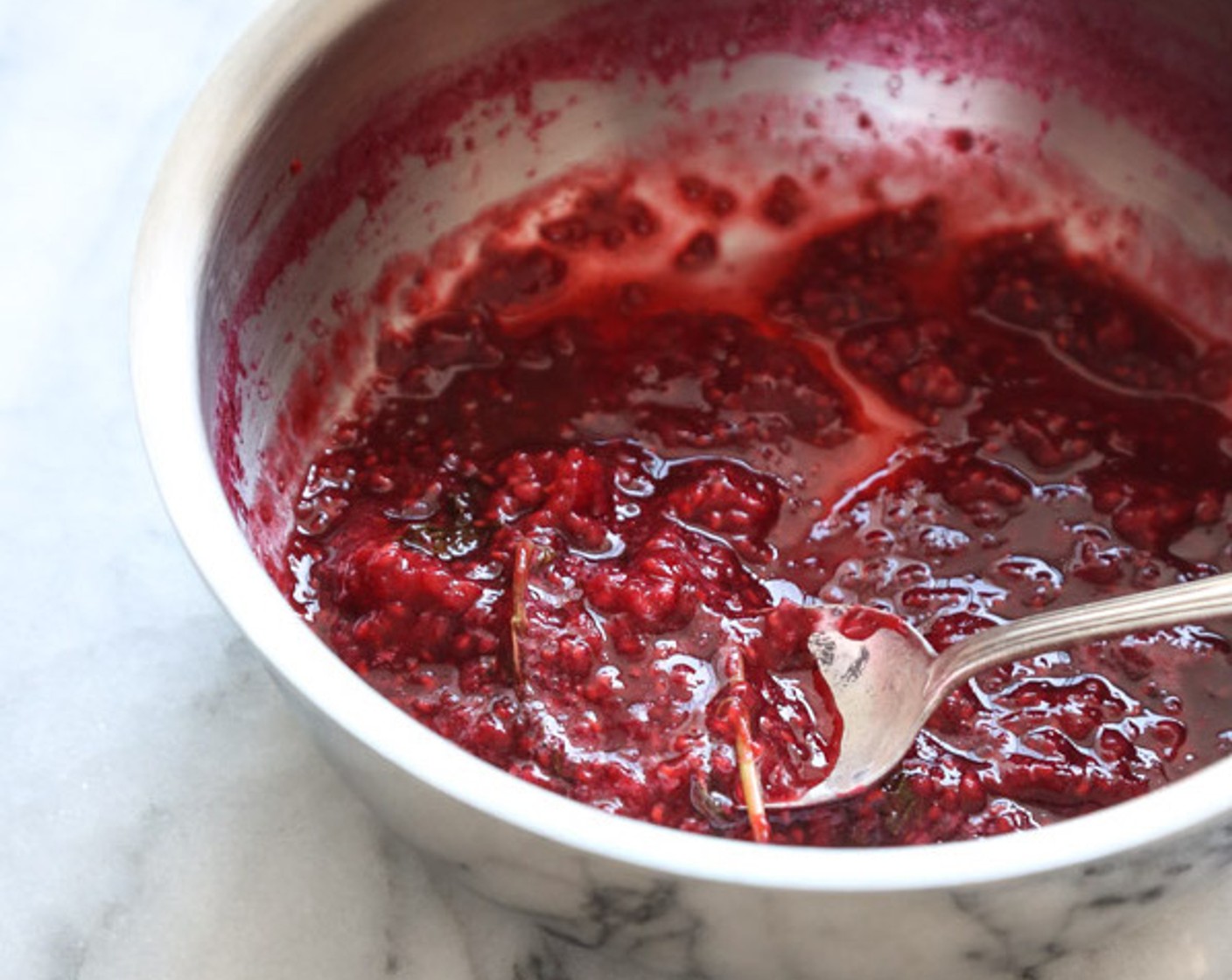 step 2 Bring the mixture to a simmer and cook over medium heat, stirring occasionally, until the raspberries have broken down into a coarse mush, about 5 minutes.