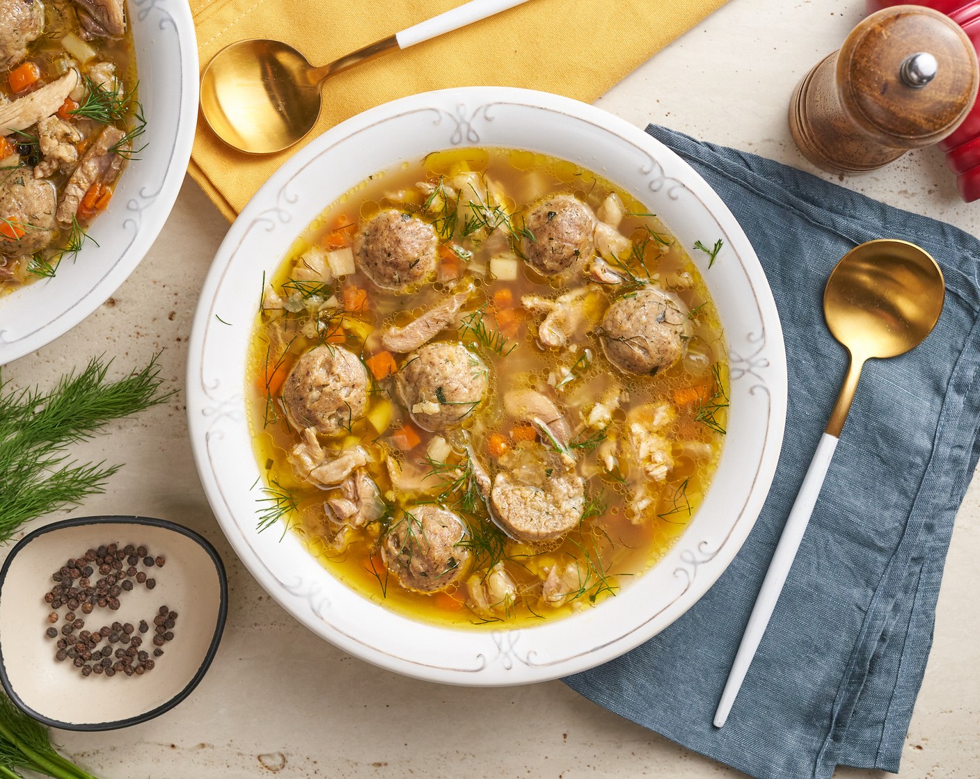 step 9 Serve the Chicken Matzo Ball Soup by ladling it into bowls along with the Matzo Balls. Garnish with fresh dill and a sprinkle of black pepper.