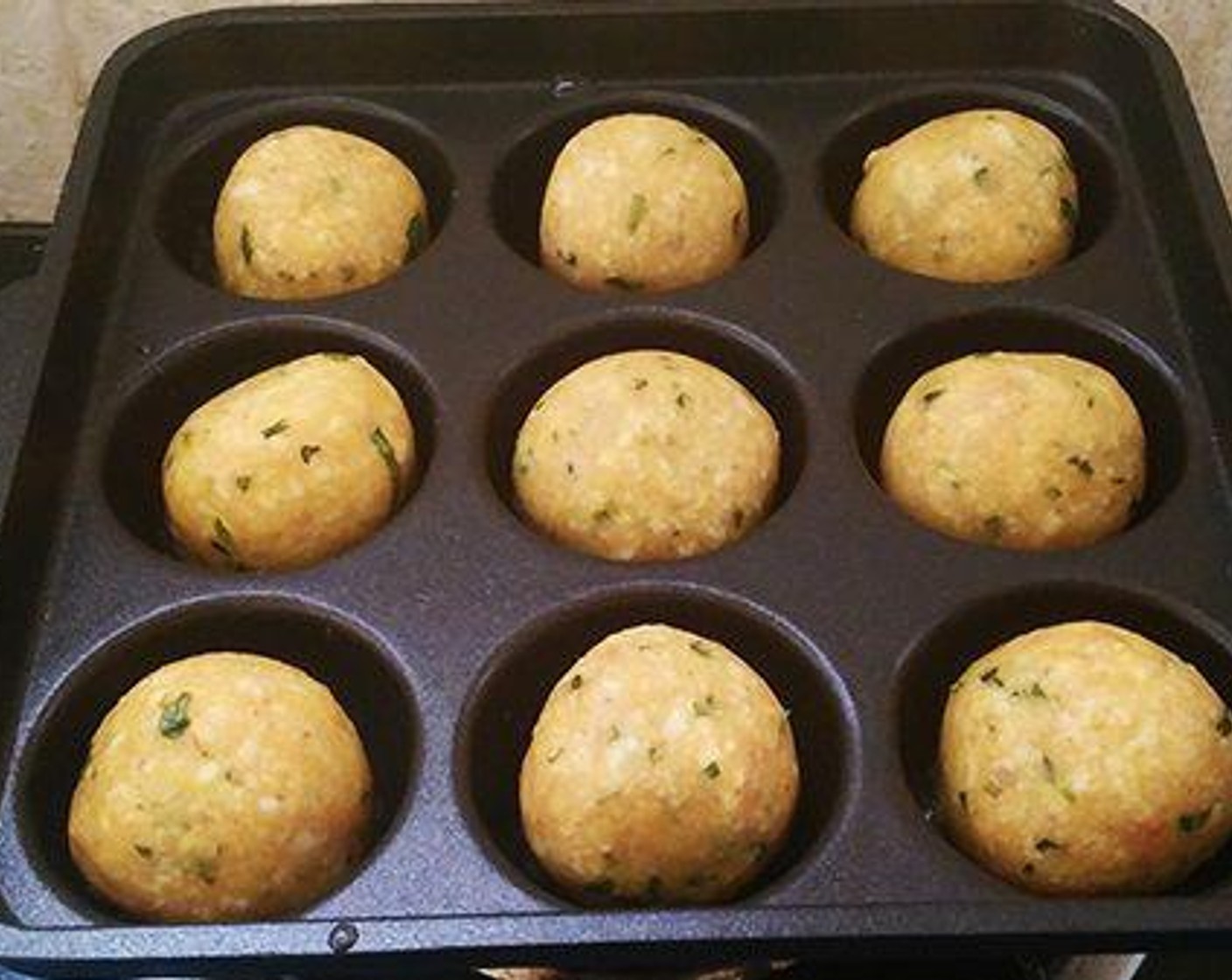 step 2 Take small portions out of the mix and roll them into balls. You can either deep fry the balls or use an appe pan and fry the koftas. Here I am using a appe pan or paniyaram pan. Pour one drop of Oil (as needed) into each hole of the appe pan. Place the koftas and cook in low flame by turning sides as necessary.