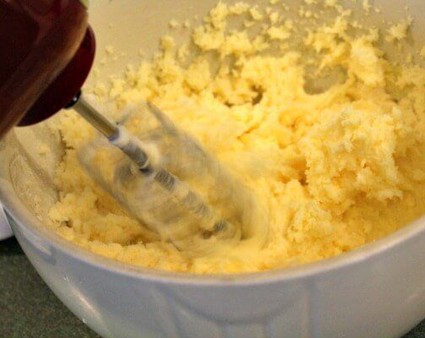 step 6 In a separate bowl, with a hand mixer, cream Butter (1 1/4 cups) and Granulated Sugar (2 cups) until light and fluffy, about 2 minutes. Beat in Eggs (2) one at a time. Add Vanilla Extract (1/2 Tbsp). Combine well.
