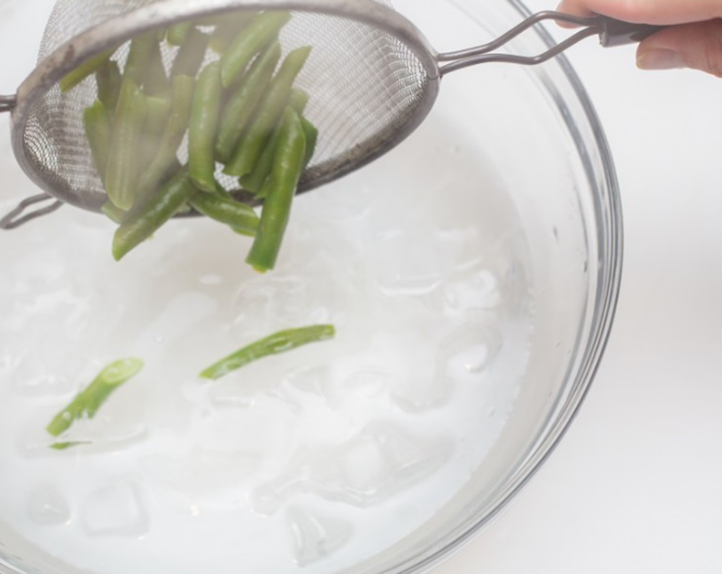 step 5 When water returns to a boil, add field peas. Cook until tender, 4-5 minutes. Remove peas with strainer, and add to ice bath.