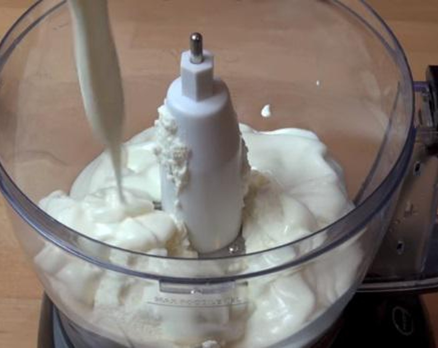 step 2 After cleaning your food processor, add in and mix the Ricotta Cheese (1 cup), and Vanilla Yogurt (1 cup).