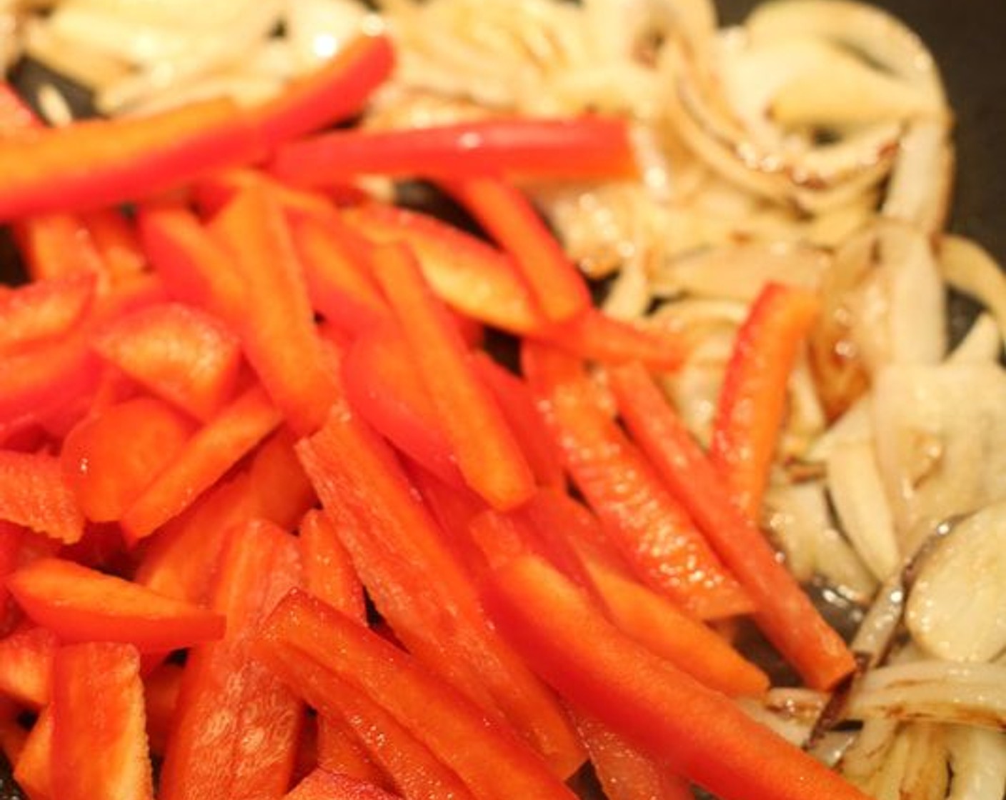 step 4 Add Red Bell Peppers (2) and continue stir frying until tender (about 2-3 minutes); add Edamame (2 1/4 cups) and cook for an additional minute or two; remove from pan and cover to keep warm.