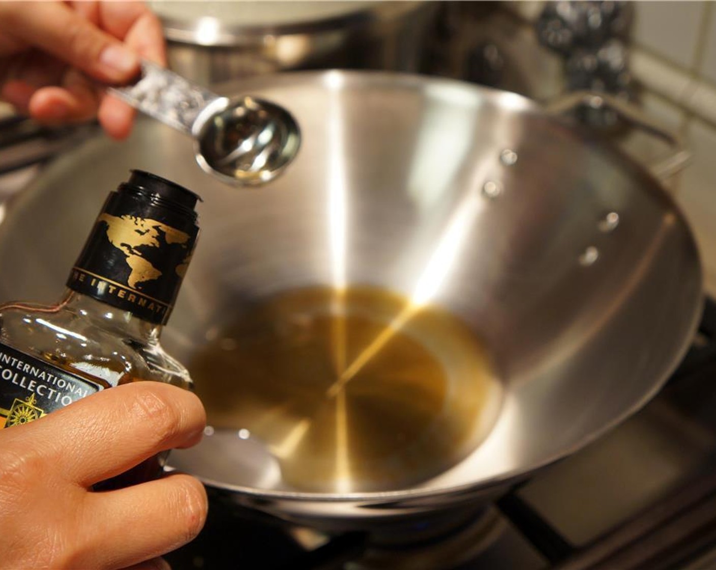 step 5 Heat wok. Add Peanut Oil (1 Tbsp) and coat the bottom and sides of the wok.