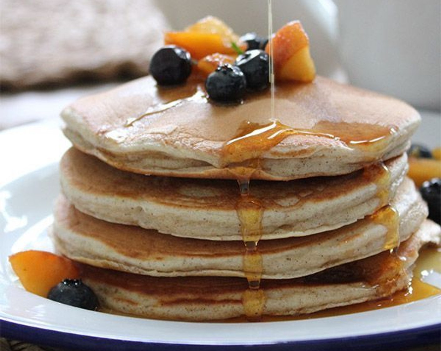 step 7 Serve the pancakes warm, with the macerated fruit and Maple Syrup (to taste).