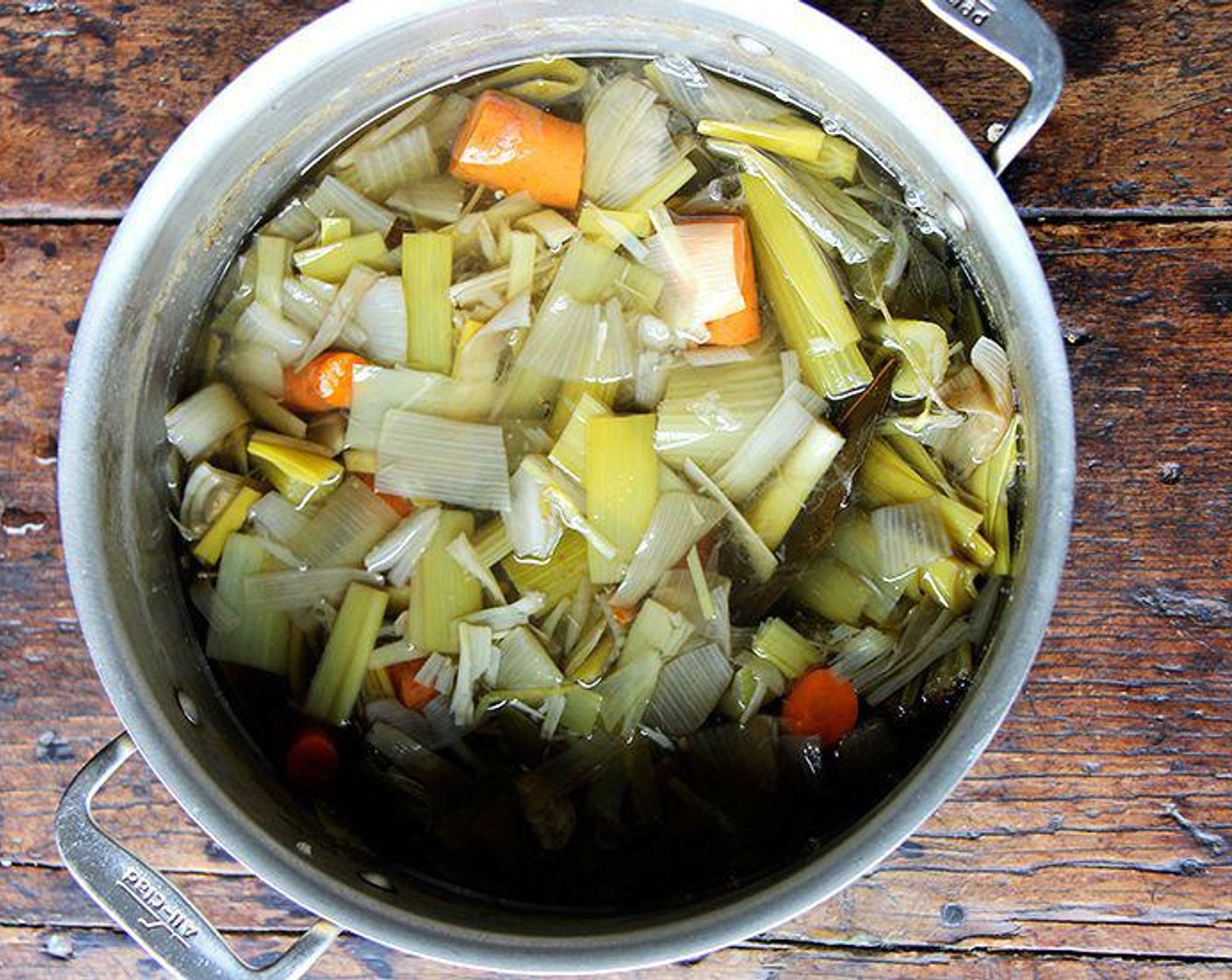 step 4 Place Vegetable Stock (4 cups) and Water (1 qt)  in a small saucepan and heat over medium heat so that it's hot but not simmering.