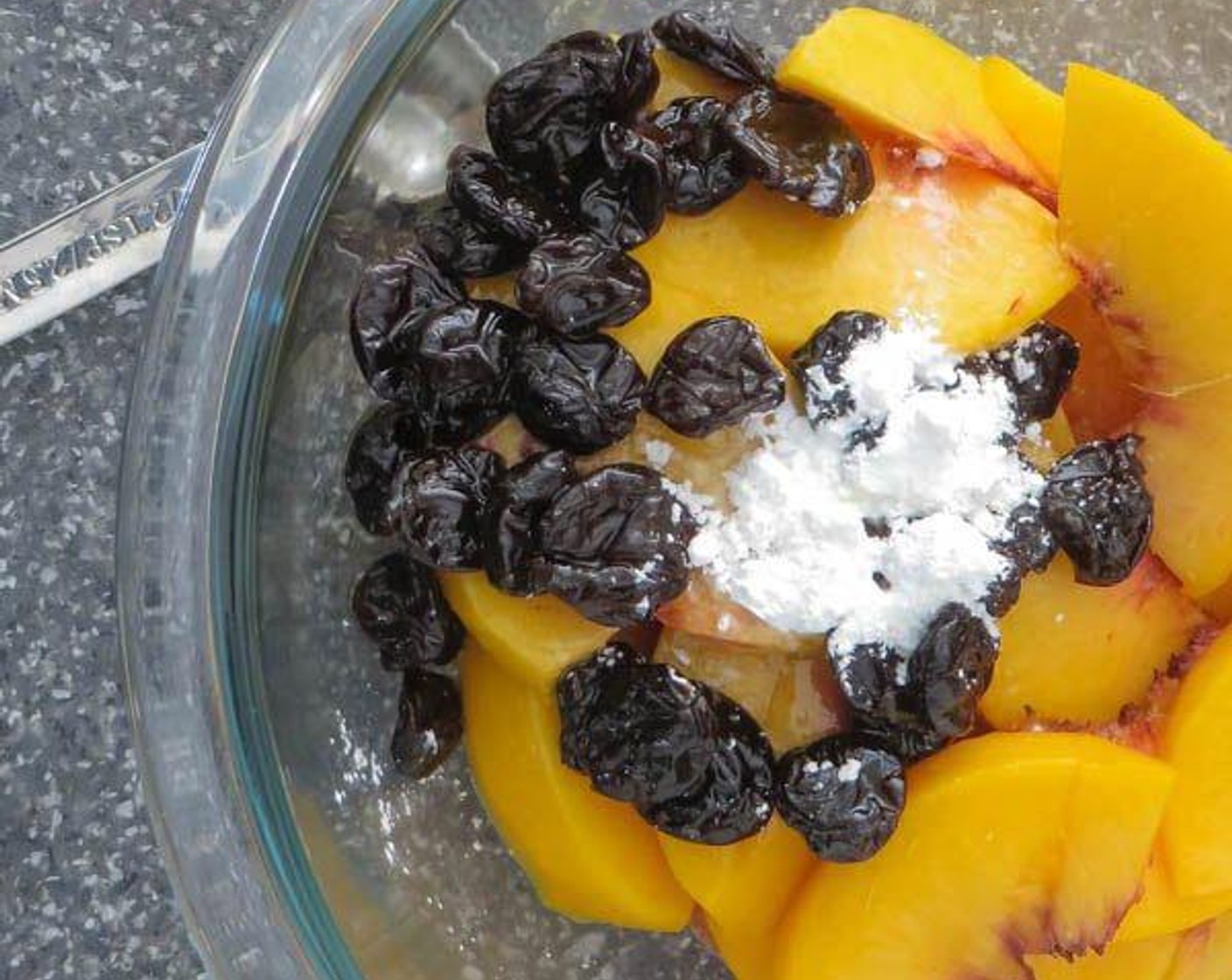 step 2 Cube the Butter (4 Tbsp) (2 ounce). Peel, pit, and slice the Peaches (2). Add Dried Cherries (4 Tbsp) and Amaretto (2 Tbsp) to a small bowl. Microwave for 30 seconds to warm, and set aside to allow cherries to plump.