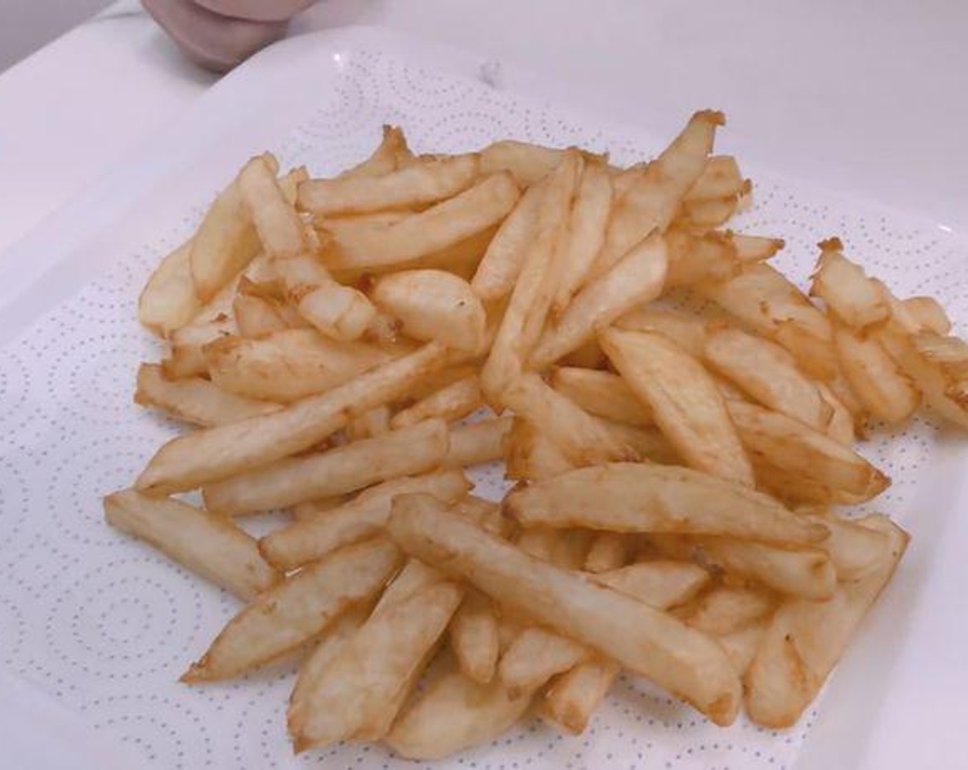 step 6 Once golden, transfer to a plate lined with paper towels to drain excess oil.