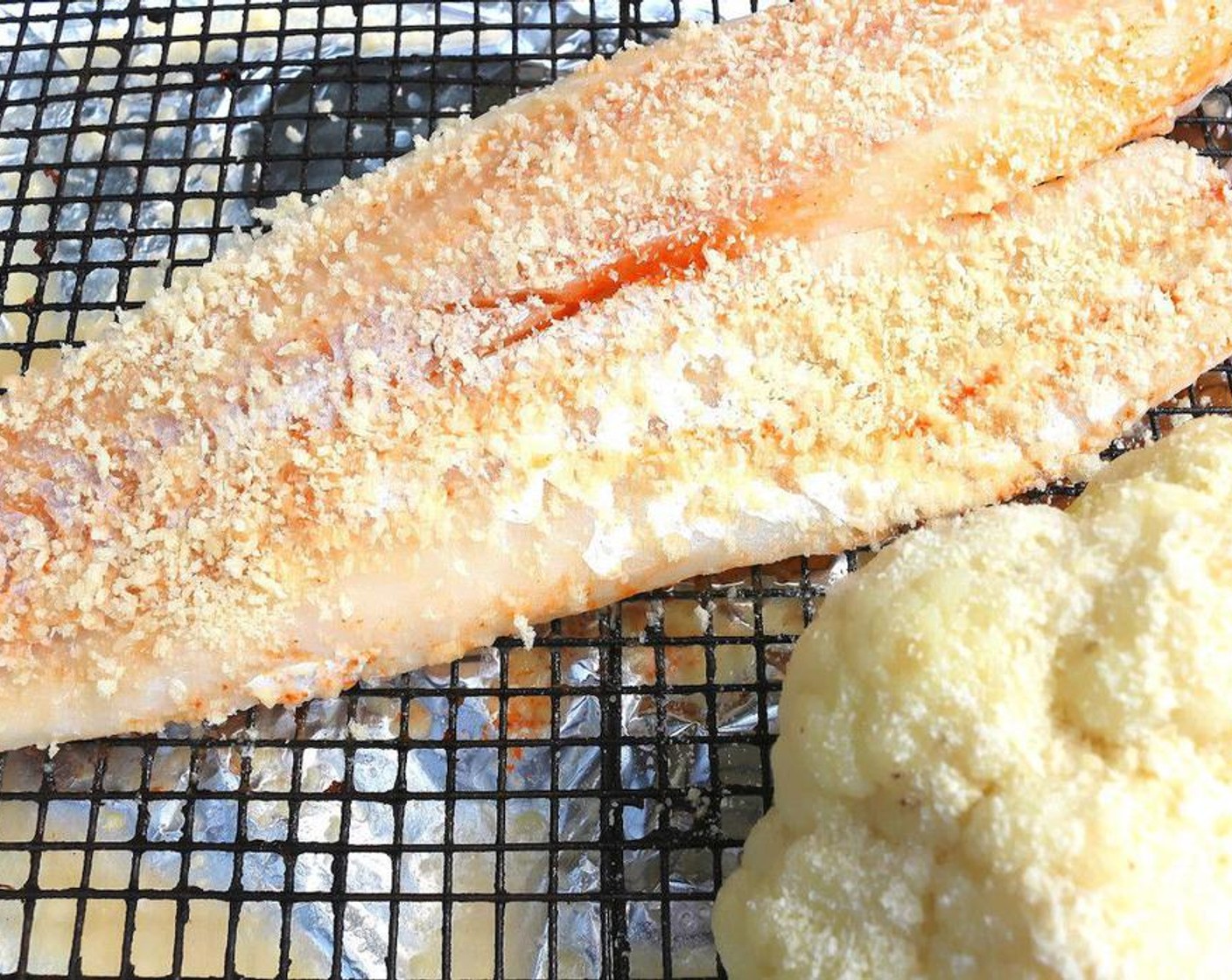 step 4 Place the fish and the cauliflower on a rack, brush cauliflower with Butter (to taste), sprinkle with Kosher Salt (to taste) and Grated Parmesan Cheese (to taste). Bake in a pre-heated oven until fish is cooked through (turn fish once). About 15 – 20 minutes, depending on the thickness of the fillet.