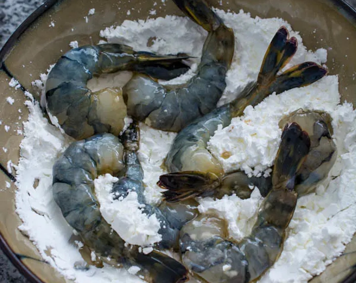 step 5 Then pour Corn Starch (1 cup) in a separate shallow bowl or plate, and coat the shrimp in the cornstarch.