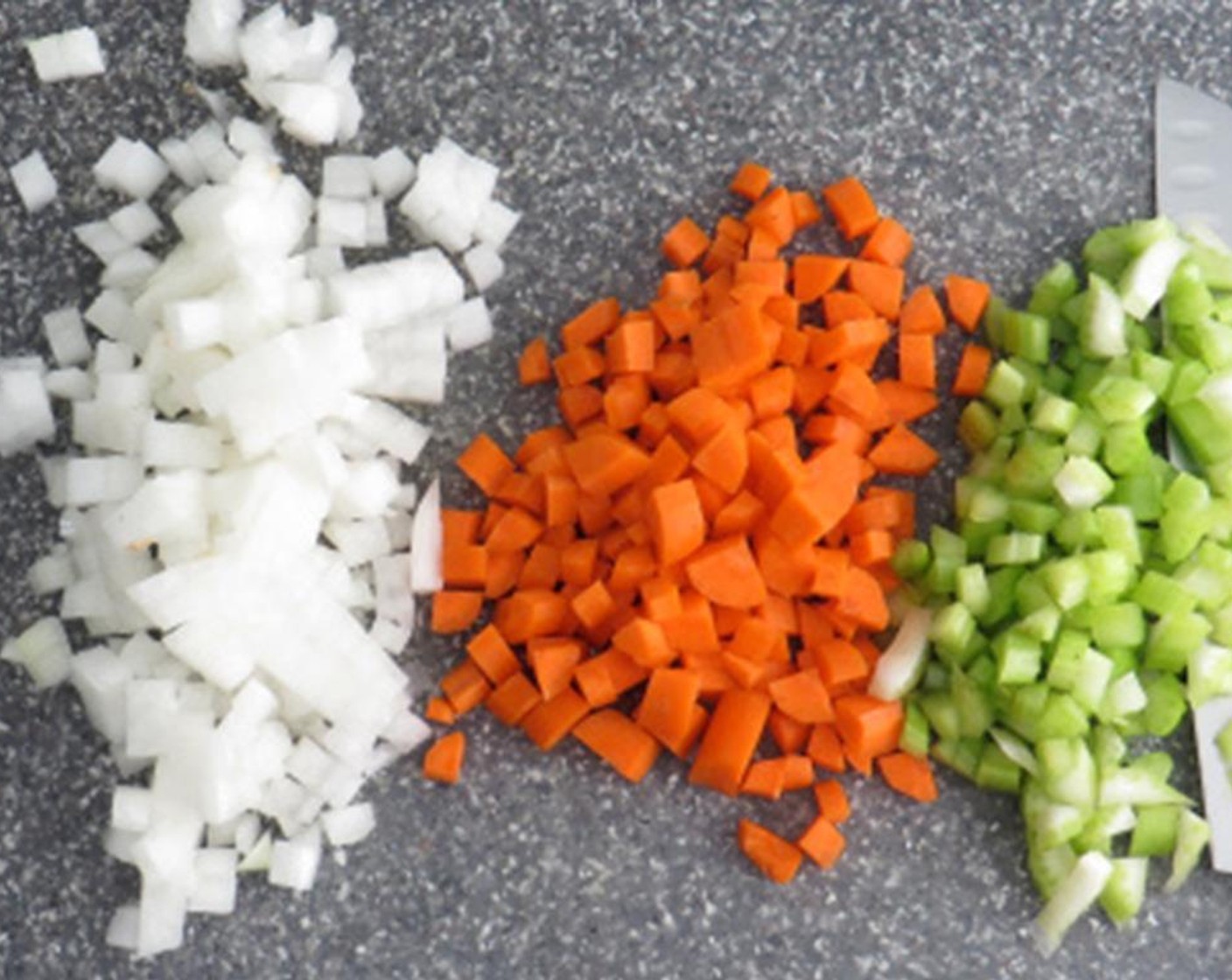 step 1 Dice the Shallots (2), Celery (1 stalk), and Onion (1/2). Peel and dice the Carrots (2). Deseed and dice the Plum Tomato (1). Chop the Fresh Parsley (1/2 cup).