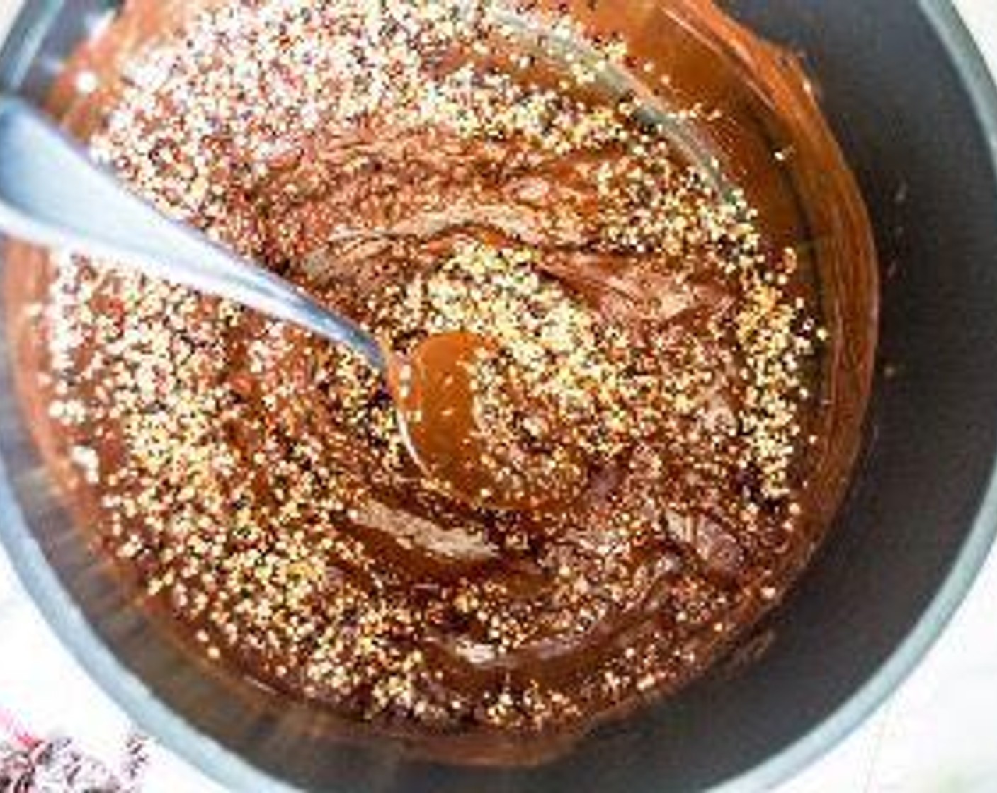 step 6 Once chocolate has fully melted, remove from heat and stir in toasted quinoa until well mixed.
