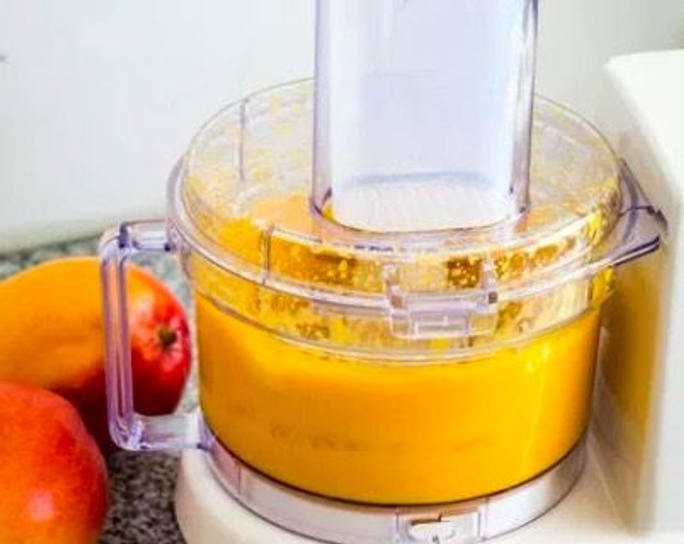 step 1 Place Fresh Mango Chunks (2 3/4 cups) into a food processor and puree until smooth. If needed, pour and press the puree through a fine sieve.