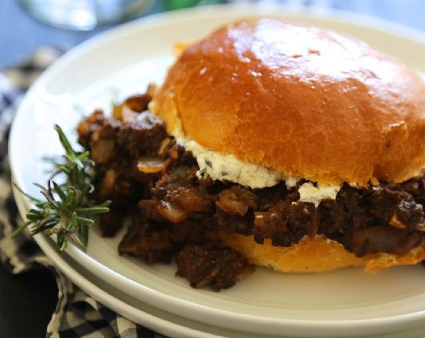 step 6 Divide the sloppy joes between 4 Brioche (4). Top the sloppy joes with a dollop of the rosemary honey goat cheese.