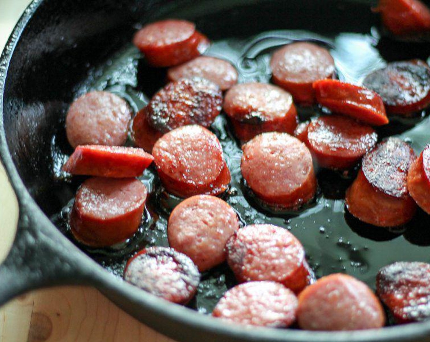 step 1 Heat Olive Oil (1 Tbsp) in a large skillet to medium high. Cut the Smoked Sausage (1 lb) into 1/2-inch sized pieces. Cook in oil until browned.