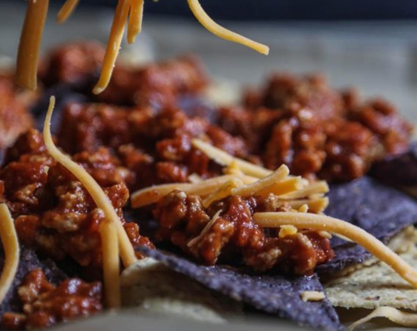 step 4 Turn on your broil. Place Multigrain Tortilla Chips (2 cups) and Blue Corn Tortilla Chips (2 cups) on a baking sheet. Top the chips with half of the sloppy joe mixture followed by Shredded Mozzarella Cheese (2 cups) and Shredded Cheddar Cheese (1 cup). Repeat step with remaining ingredients.